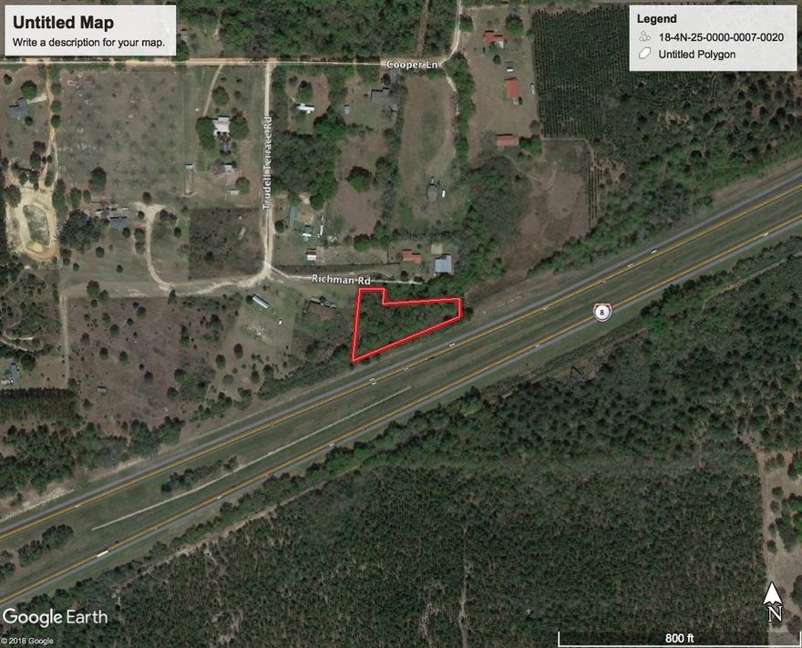 Wooded level homesite. Great place for a mobile home. Billboard on the back retains easement for sign access.
