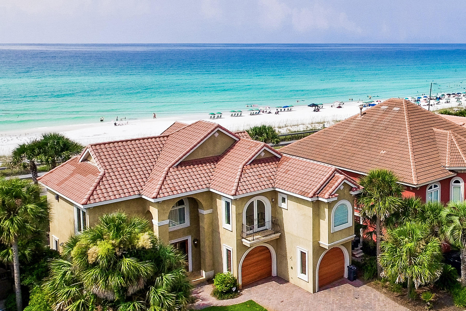 50 Ballamore Cove is an exceptionally maintained Avalon Estate with unobstructed beach & ocean views. The two-story residence features a gorgeous entryway to the home highlighted by a tile mosaic leading in to the ground floor entertainment area. Two large bedrooms with en-suite baths as well as a third full bath servicing the living area and pool access are also on the ground level. The 2nd story features an incredible open design highlighting gulf views from each window. A large master suite features a stunning bathroom. Travertine tile, marble, onyx and granite are utilized throughout the home in a brilliantly polished and maintained custom design. The main kitchen appliances and outdoor gas grill are GE Monogram series. This is the only home available in Avalon with unobstructed views.