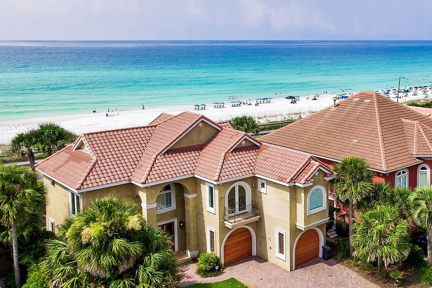 50 Ballamore Cove is an exceptionally maintained Avalon Estate with unobstructed beach & ocean views. The two-story residence features a gorgeous entryway to the home highlighted by a tile mosaic leading in to the ground floor entertainment area. Two large bedrooms with en-suite baths as well as a third full bath servicing the living area and pool access are also on the ground level. The 2nd story features an incredible open design highlighting gulf views from each window. A large master suite features a stunning bathroom. Travertine tile, marble, onyx and granite are utilized throughout the home in a brilliantly polished and maintained custom design. The main kitchen appliances and outdoor gas grill are GE Monogram series. This is the only home available in Avalon with unobstructed views.