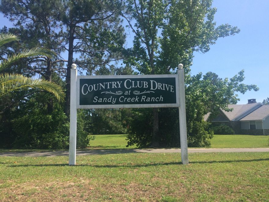 Great location 2.7 acres in the middle of well established subdivision. Parcel has 2 buildings with metal roof. One is clubhouse that totals over 2000 sf other is large garage/warehouse over 2300 sf. Property has security lights that were added in 2002. Priced to sell, this property has a lot of potential. Bring all offers!