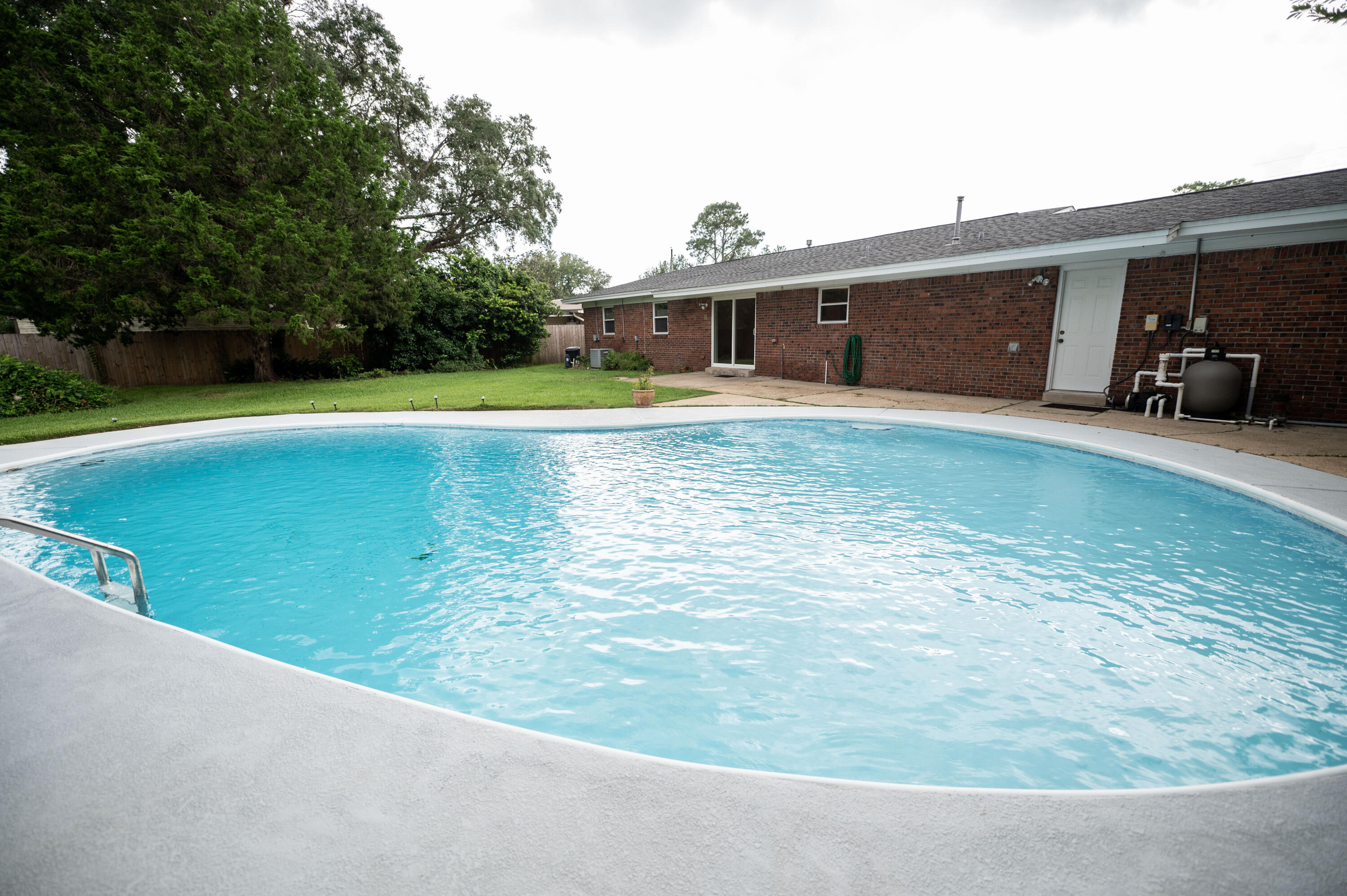 One word says it all - Kenwood. What does this home offer you as a homeowner? In 2014 the home was completed rewired and brought up to code. New carpet and new flooring installed in 2021.The water heater was 2021. The HVAC was 2011. The roof was completed in 2016. The windows are double hung wind rated vinyl windows. The lawn pump was replaced in 2020. The gunite pool was completely resurfaced and pool equipment upgraded in 2019/2020. New refrigerator in 2019. Convenience is not lacking with the location situated between Eglin Air Force Base and Hurlburt Field. The elementary school is located a block from the home. Tennis courts are a short distance away. The two separate living areas makes it great for function or just having your own space. There is great storage in the hallways.