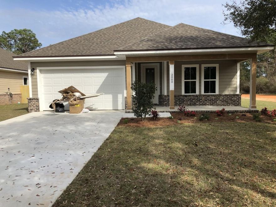 BEAUTIFUL HOME WITH 9ft CEILINGS ON A LEVEL CORNER LOT. MANY CUSTOM FEATURES. 3 BEDROOM 2 BATH WITH AN 8FT FRONT DOOR. . TREY CEILINGS WITH CROWN. KITCHEN WILL BOAST CUSTOM ALL WOOD CABINETS WITH SOFT SHUT DRAWERS, GRANITE COUNTER TOPS ALONG WITH WOOD LOOKING TILE IN THE FAMILY ROOM, KITCHEN, BATHROOMS & LAUNDRY ROOM. FLOOR PLUG IN FAMILY ROOM. RECESSED LIGHTING AND GRANITE COUNTER TOPS, CUSTOM TILE SHOWER WITH SEAT IN THE MASTER SHOWER WITH BENCH, RAINHEAD AND SEPARATE SPRAYER.YOU WILL LOVE THE OPEN FLOOR PLAN AND LARGE FAMILY ROOM THAT OPENS TO A LARGE COVERED BACK PORCH. THIS HOME IS PERFECT FOR ENTERTAINING. THE KITCHEN HAS stainless appliances w/ refrigerator w/ ice maker, LARGE PANTRY, BAR AND A DINING AREA WITH GREAT VIEWS. The yard will be FULLY SODDED and have a PRIVACY