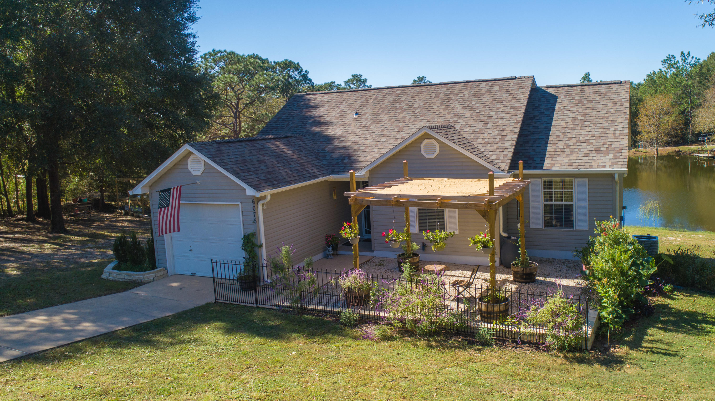 Due to COVID and to eliminate exposure, all 'first' showings can be done at the Open House on Saturday November 7th between 11-1 pm. Then private showings thereafter.*VIRTUAL TOUR AVAILABLE*CALLING THOSE WHO LOVE THE OUTDOORS! OVERSIZED LOT WITH LARGE POND IN BACKYARDTruly a dream for anyone who enjoys the outdoors, this three-bedroom two-bathroom home is one you have to see. Set back on a large lot in Crestview, the second-story deck is really the highlight of the home. With a pergola and retractable awning, shades on the side to protect from the late afternoon sun, and bench seating as well as space for table and chairs, this is the place you'll want to spend for both morning coffee and evening sunsets!
