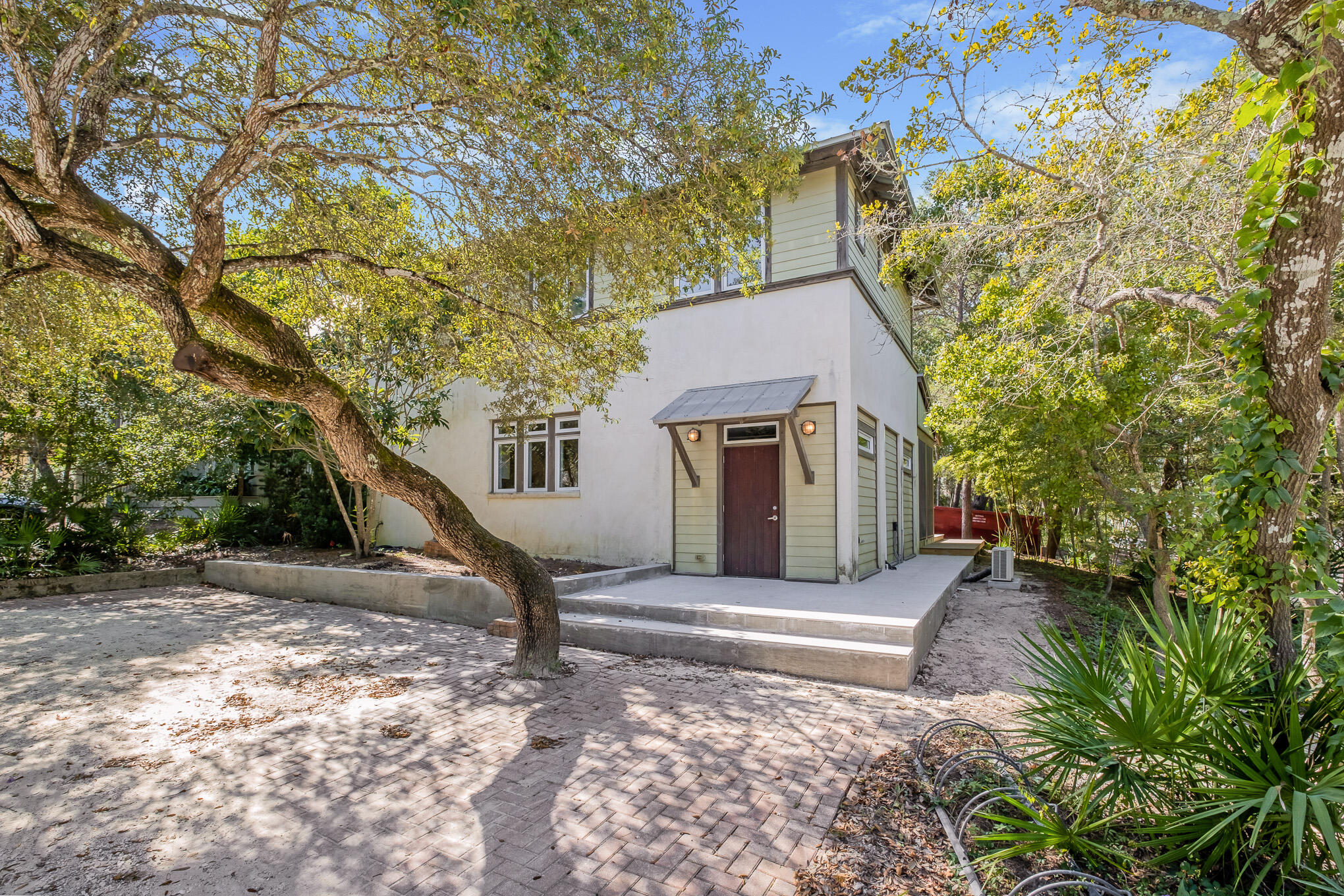 Enjoy living within steps of Seaside and the beach! Old Seagrove with its beautiful canopy of Live Oak trees to admire. With all the amenities of Seaside, just steps from your front door! This home has two bedrooms, two and a half baths, and a bunk bed guest room. It is designed as a vacation home and its oversized lot will accommodate another main structure in excess of 3,000 sq. feet with gulf views from a third story. Built by Artisan and has many high end features. Pecky Cypress Ceilings and other luxury features