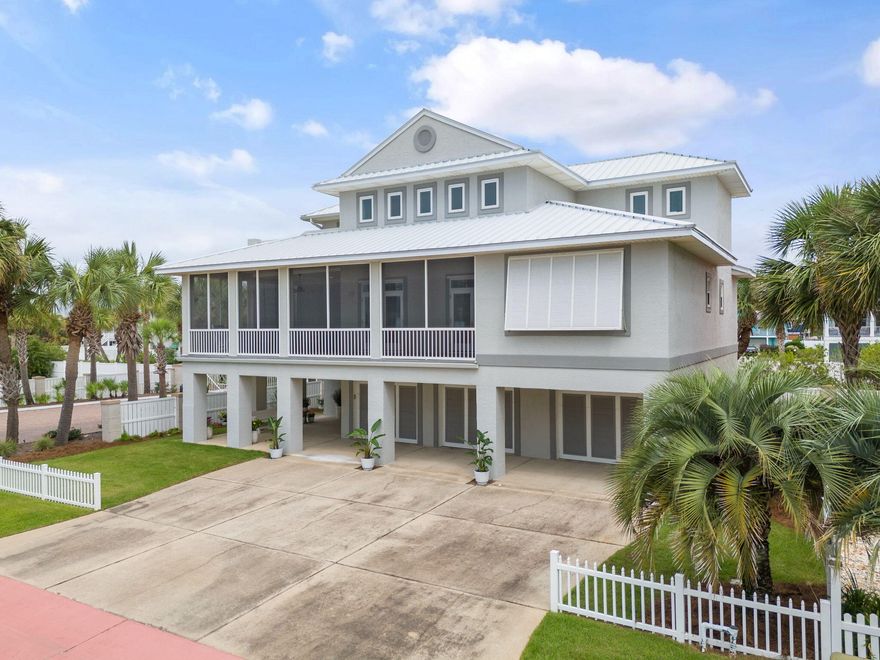 Sun, sand & Gulf breezes. Paradise awaits at this 5-bedroom coastal beach home in the exclusive, Gulf-front community of Parasol in Perdido Key. This bright & cheery custom-built residence boasts over 3,000sf of space under roof & features top-notch construction with numerous upgrades including NEW HVAC & NEW Sentricon bait stations. You'll be impressed by the dry lock aluminum decking on the upper balcony, porcelain tile on the 2nd-floor patio, & upgraded flooring in the 3rd-floor Jack & Jill bathroom & 2nd-floor bath. The exterior has been refreshed with elastomeric stucco paint, resurfaced columns, & updated attic insulation at 19.75'' R60 works to keep the home cool & comfortable. The residence also includes an upgraded aluminum rails, screens, & fan on the 2nd-floor patio, exterior lights, & a  2" standing seam double lock aluminum roof with 12" panels & matching fascia trim installed in 2021. The exterior is truly top-notch & decked with hurricane shutters & hurricane-rated windows. Inside this beach home is a welcoming layout & ample space to relax & unwind after a long day under the sun. The large kitchen, perfect for entertainment, is adorned with granite countertops, an island bar, & stainless-steel appliance. Other notable features include a beautiful color palette of interior paint, tiled living area & storage room off the garage & downstairs guest/kids' suite. The primary bedroom is generously sized, with a primary bathroom that includes split vanities & walk-in closet. The 3rd-floor balcony provides a breathtaking view of the Gulf. Relax on the over 800sf of porch area. The greatest convenience is the elevator servicing all three floors! Enjoy your days at the beach or out on the open waters of the Gulf & store your water equipment in the expansive 3-car garage.  Parasol is a gated, rent-restricted community offering a community pool & over 900 feet of gulf frontage, easy access to the National Seashore, & captures all the beauty of PARADISE!