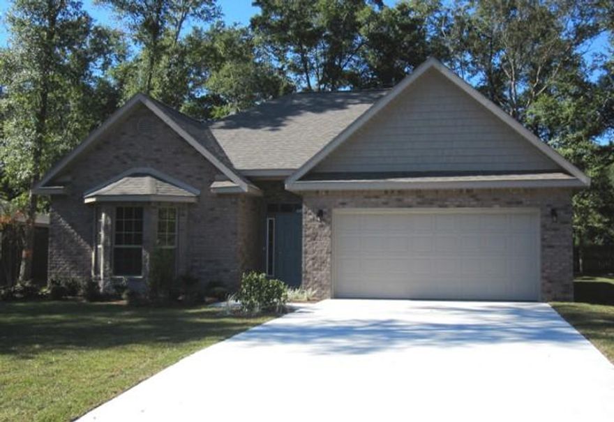 Graham Ranch all Brick home, split and open with Great natural light. Wood look tile, Stainless appliances, trim package, irrigation and well for low maintenance lawn care. Beautiful Bay window in Secondary bedroom! Home backs up to wooded greenspace. Sunroom adds additional square footage and tons of Natural Light! Best New Home Value in Santa Rosa Beach!