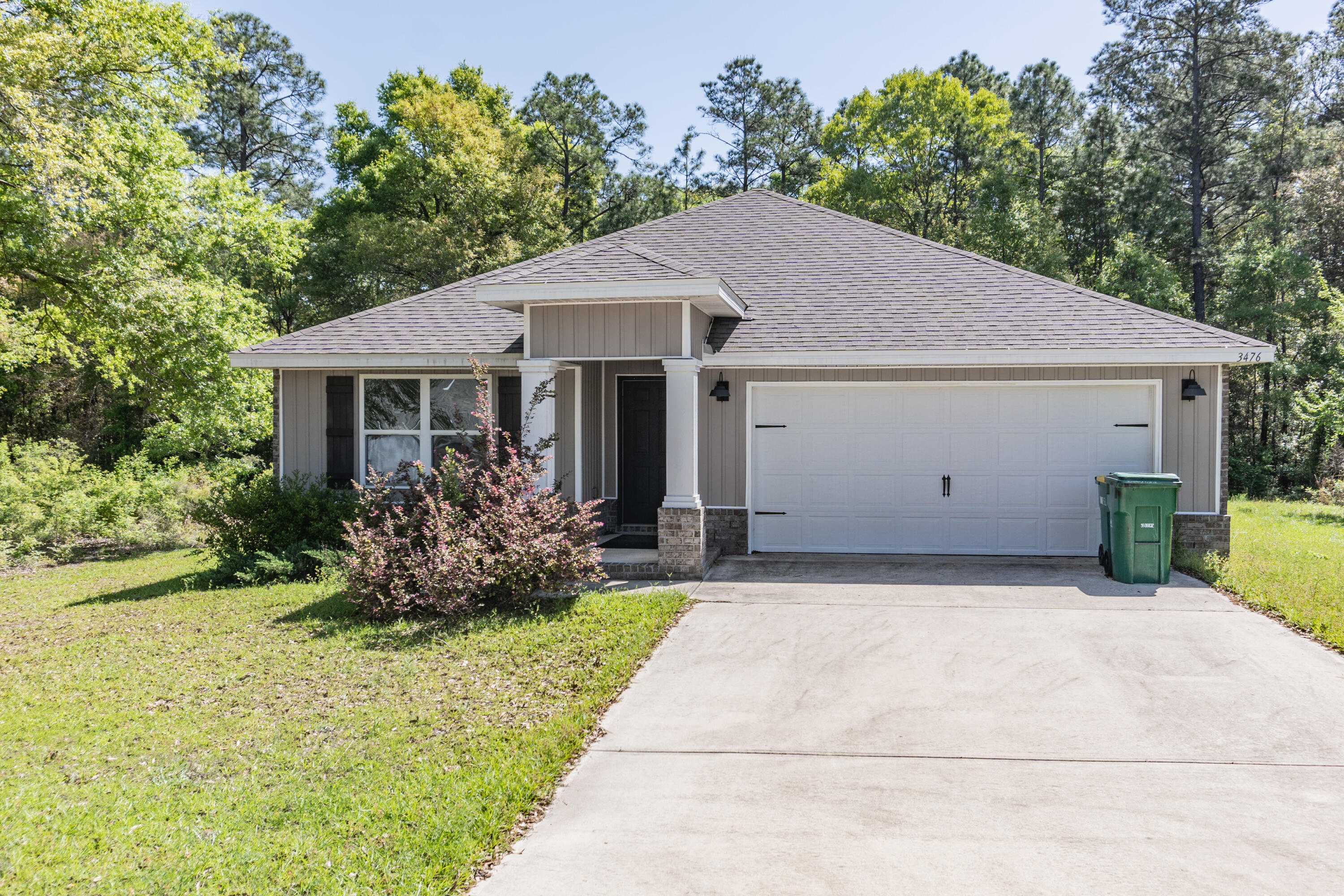 Available 04/17/2025.....Beautiful home in North Crestview is a must see. Adorned with custom light fixtures, living room accents, custom paint in the master and upgrades throughout. Open concept floor plan features 4 bedrooms and 2 bathrooms. Spacious with 1846 sqft. of living space. LVP flooring and carpet in the bedrooms. Large open kitchen with island, stainless appliances, and corner pantry. This floor plan can accommodate large furniture and sectionals. 2 car garage, covered back patio, mature landscaping with wooded privacy. No inside smoking or vaping. Pets will be allowed with owner approval and a $400 non-refundable pet fee. Perfect place for outdoor entertaining and country living. Put this on your list for viewing.