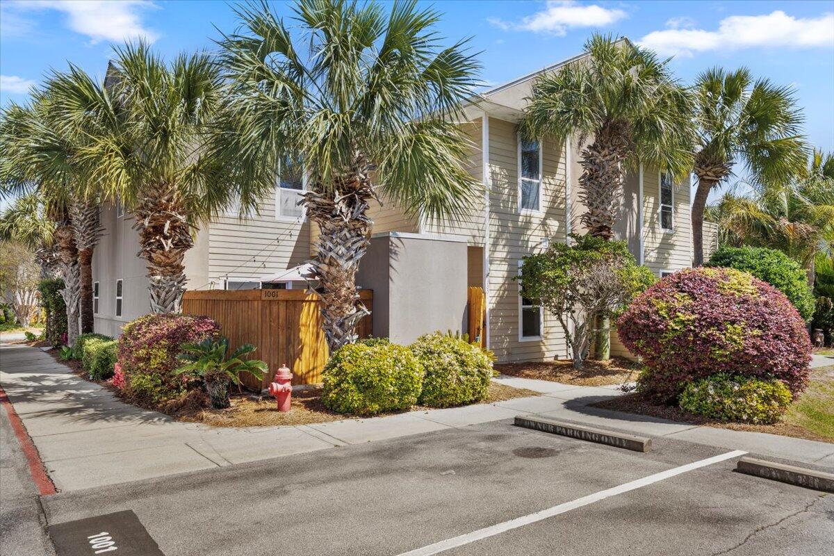 DEEDED BEACH only 2/10ths of a mile from the front door of this updated, amazing 2 bedroom 2.5 bathroom roommate floor plan townhome with low monthly HOA dues. Gorgeous, private courtyard greets you with an outdoor shower and oversized closet for all your beach gear. Once inside you will marvel at ceramic tile floors, freshly painted interior and updated furnishings. All stainless steel appliances and a fully stocked kitchen with everything you need conveys with the sale. Upstairs there is new luxury vinyl plank flooring with two large bedrooms with en-suite bathrooms, a laundry room, and private balcony. A community pool is located 1/10th of a mile from the home. Rarely do these 2 bedroom townhomes hit the market and this one is turnkey and ready for you!