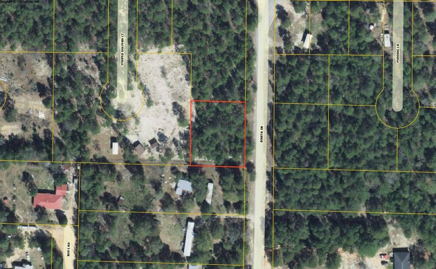 Great location just 1/4 mile off Hwy 90 between Defuniak Springs and Mossy Head in North Walton County. Large double lot at apx. .43 acre would be a great location for your new home or land/home package. No utilities currently on property but there is power all around on this road and public water should be available (Mossy Head Water Works). Septic would be required.