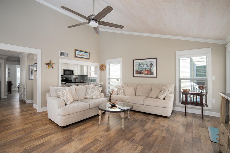 SHOWSTOPPER!! COMPLETELY RENOVATED & ONLY 850 FEET TO BEACH!You will be amazed at the tasteful quality style of this property. KITCHEN has been completely gutted and rebuilt. Opening to living room increased for spacious feel. All NEW shaker cabinets w/soft close features, spice rack, trash bin, lazy Susan & big drawers. Counter height counter w/gorgeous White Marble QUARTZITE. NEW- Lighting, under cabinet lighting, SS appliances-Dbl Oven, Quiet mode dishwasher, Custom glass backsplash & tall pantry cabinets. LIVING RM-NEW -Tongue & Groove ceiling, storm french doors, Luxury Vinyl Plank floors, sheetrock and paint. MASTER BR/BATH - Renovated-NEW-carpet w/gel padding, ceiling fan, mini split AC, widened w/i closet w/storage system. RENOVATED MBATH - LVP floors, cabinets, QUARTZITE (cont.