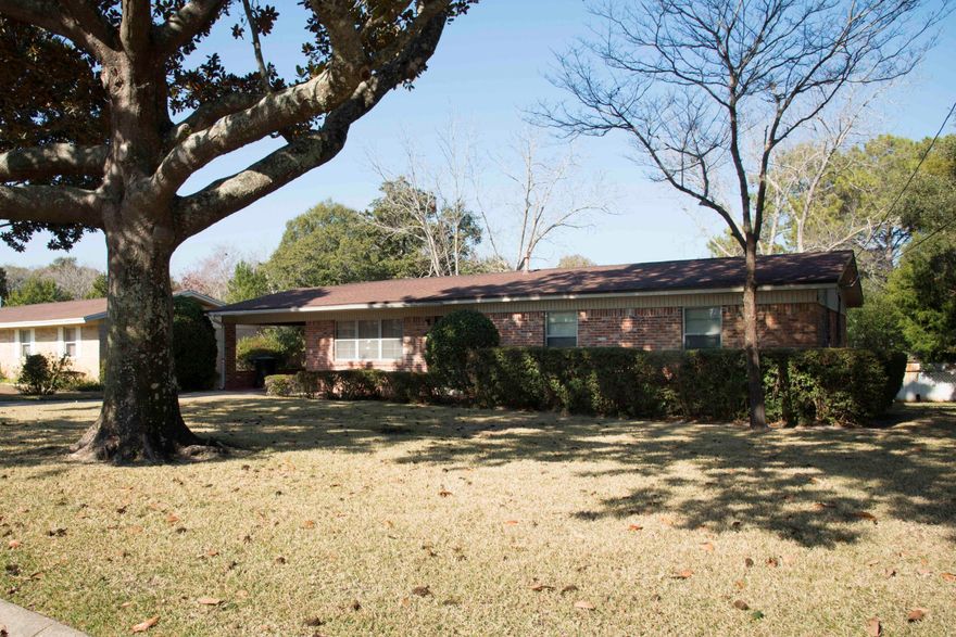 All brick home in established neighborhood. Centrally located with mature landscaping! Close to both bases. Large family room and formal living room. Dining room off kitchen. Back yard fenced and covered patio. Sprinkler system and lawn pump.