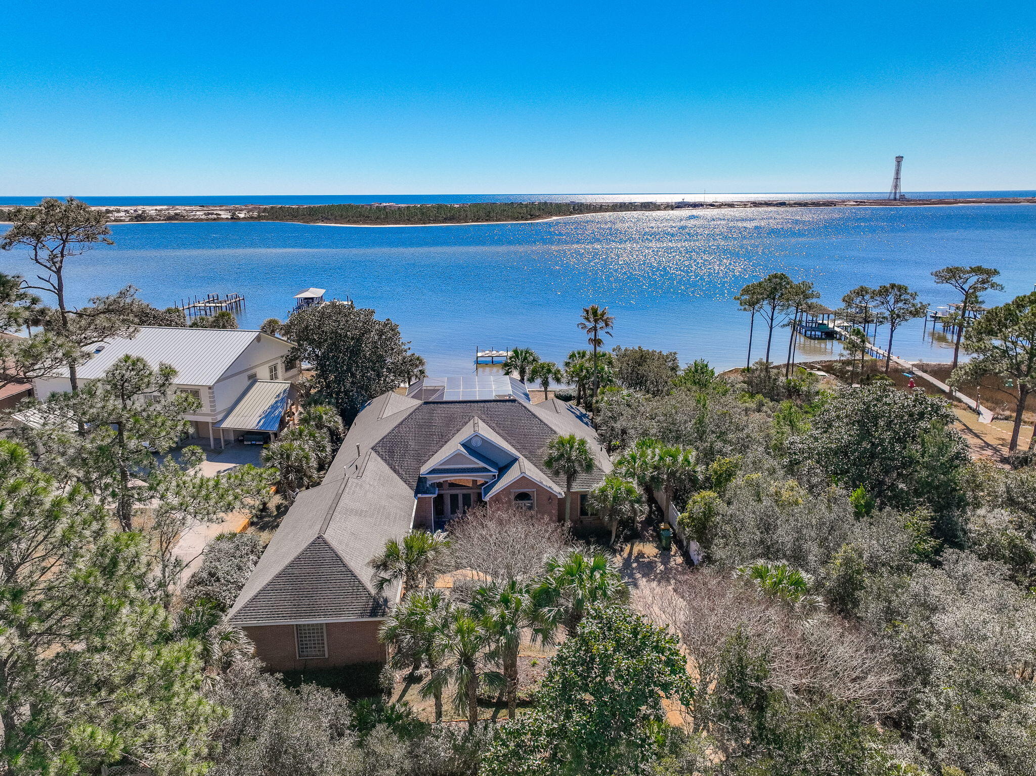 AUCTION ALERT!!! Selling at AUCTION to settle ESTATE.ONLINE Auction.Bidding Opens 8/19/25 and closes 8/26/25 at NOONFor More Info please call or text Chris at 850-502-7879Price reflected is where we believe the bidding will start. Previously listed at $1,750,000Welcome to a rare opportunity to own a distinguished waterfront estate nestled on a private, one-acre lot along the bay. Combining timeless design with modern comfort, this expansive compound offers unrivaled privacy, breathtaking views, and a lifestyle of luxury and leisure.Main Residence | 3 Bedrooms 3.5 Bathrooms 2-Car GarageAt the heart of the estate sits a meticulously maintained 3,431-square-foot main residence, thoughtfully designed to capture panoramic bay views from nearly every room. With a flowing, open-concept floor plan and an abundance of natural light, this home delivers both refined elegance and relaxed coastal charm.
~Expansive primary suite with water views, spa-like bathroom, and walk-in closets
~Two generously sized guest bedrooms, each with ensuite baths for maximum comfort and privacy
~Formal and casual living areas, ideal for entertaining or enjoying quiet evenings
~A chef's kitchen outfitted with premium appliances, custom cabinetry, and a spacious island
~Elegant dining room, perfect for hosting dinner parties or intimate gatherings
~Dedicated office/library, ideal for remote work or reading retreats
~Interior laundry room, ample storage, and upgraded systems throughout
~Step outside to your screen-enclosed private pool and patio oasis, offering year-round enjoyment under the Florida sun. Whether swimming laps, hosting gatherings, or savoring sunset cocktails by the water, this outdoor living area is a true extension of the home's luxury appeal.
Carriage House | 1 Bedroom " 1 Bathroom " 2-Car Garage
Located just steps from the main residence is a detached carriage house, providing an additional one-bedroom, one-bathroom private living space. Perfect for guests, extended family, a home office, or rental income potential.
This extraordinary property is being offered via auction, providing a unique opportunity to secure one of the area's most exclusive bayfront residences. Whether you are looking for a primary residence, vacation home, or investment with income potential, this estate delivers on every level.