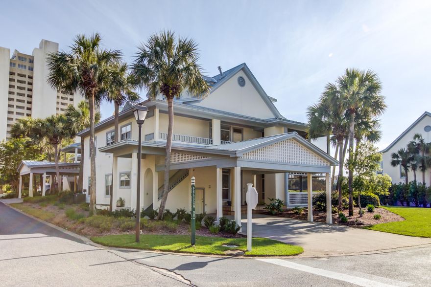 Ideally located across from the Gulf with walking distance to the private deeded beach of Hidden Dunes. This prime location rarely comes available, with 280 square feet of screen porch viewing the lake. End unit with covered parking close to community pool. Two story family room. Updated kitchen with pantry, gas cooking and granite countertops. Master suite accesses back porch and views the lake. Three bedrooms, 3 updated full baths on the main level in a private wing. Upstairs bonus area includes a vaulted den with sleeper sofa, private guest suite with two queen beds and an additional full bath. This condo is currently a great rental but the layout would be ideal for full time living with plenty of storage closets inside and out.