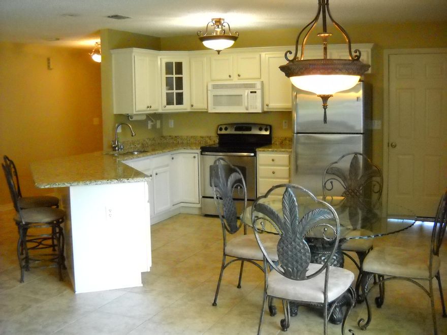 Outstanding location near the Heart of Downtown Destin,and loaded with many upgrades!Entering the home you will appreciate the spacious tiled living area adorned with beautiful lighting throughout. Granite countertops in the kitchen, master bedroom bathroom and guest bathroom compliment the other quality finishes the home has to offer. The Master bedroom is tiled as well with aLarge walk-in closet. Two other bedrooms at the front of the home are separated by a full bathroom.Located on a cul-de=sac with a yard that is easy to keep, this home is only a few moments away from one of the Top 5 Harbors in the nation with the Harbor walk's Dining, shopping and entertainment venues readily available.Great location for getting to the Military bases as well, and qualifies for VA finan