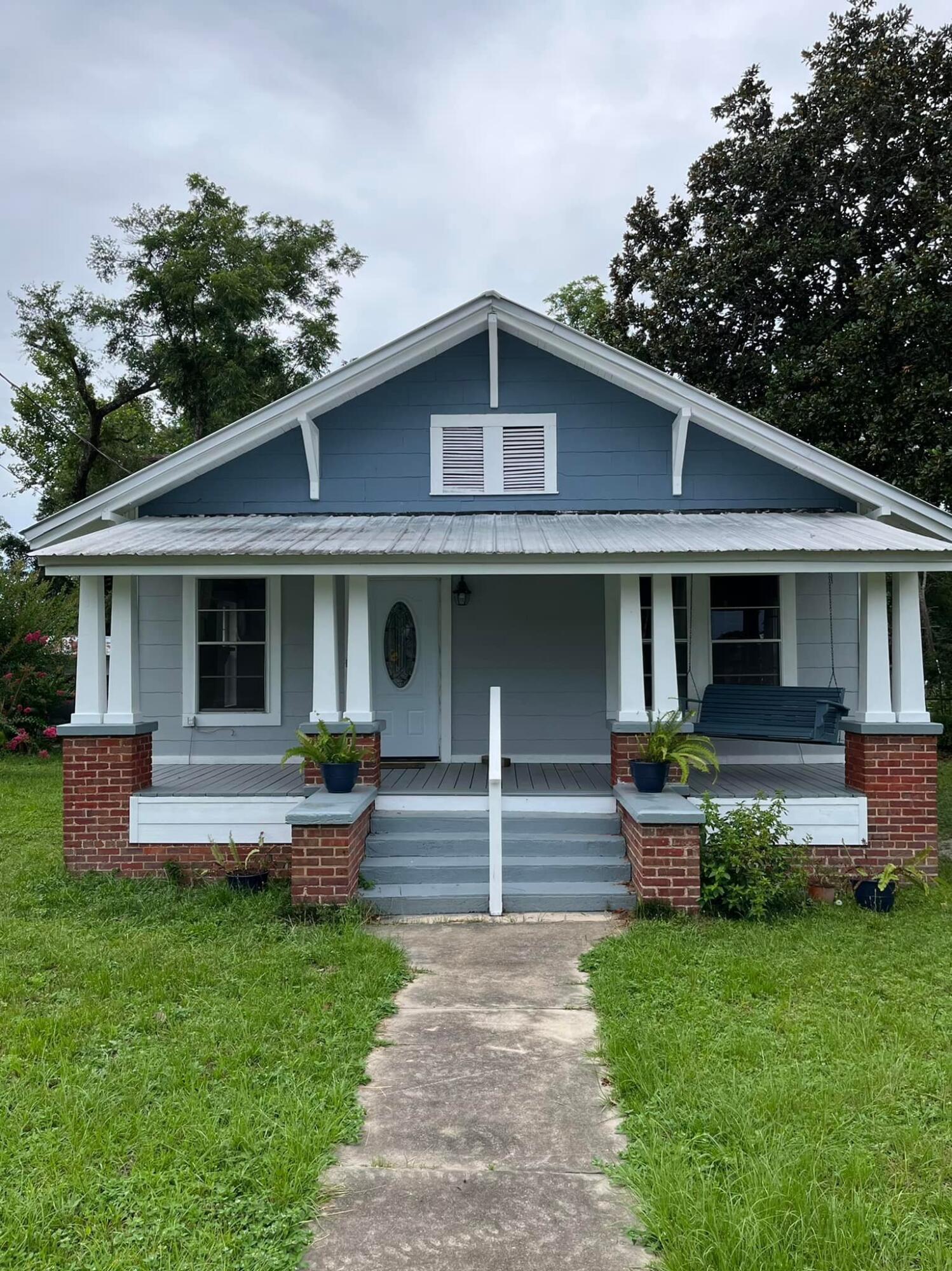 Large fully renovated historic Florida Cottage located on a corner in the heart of DeFuniak Springs and just a short distance from the Lake yard and our historic Main Street area. The 8x25 front porch is made for front porch sitting. As you enter the home, the front room is a sizable living room with a fireplace, which leads you into a well appointed dining room. The kitchen has all of the character of the 1940s with the conveniences of today. There are three bedrooms and two bathrooms, along with a Florida room across the back of the home! There is a carport and a nice backyard with fruit trees. Your credit score must be 600 or better. Your income must be 2.5 times the monthly rental rate and have one year of the same employment. Pets are not allowed. Background & credit check required.