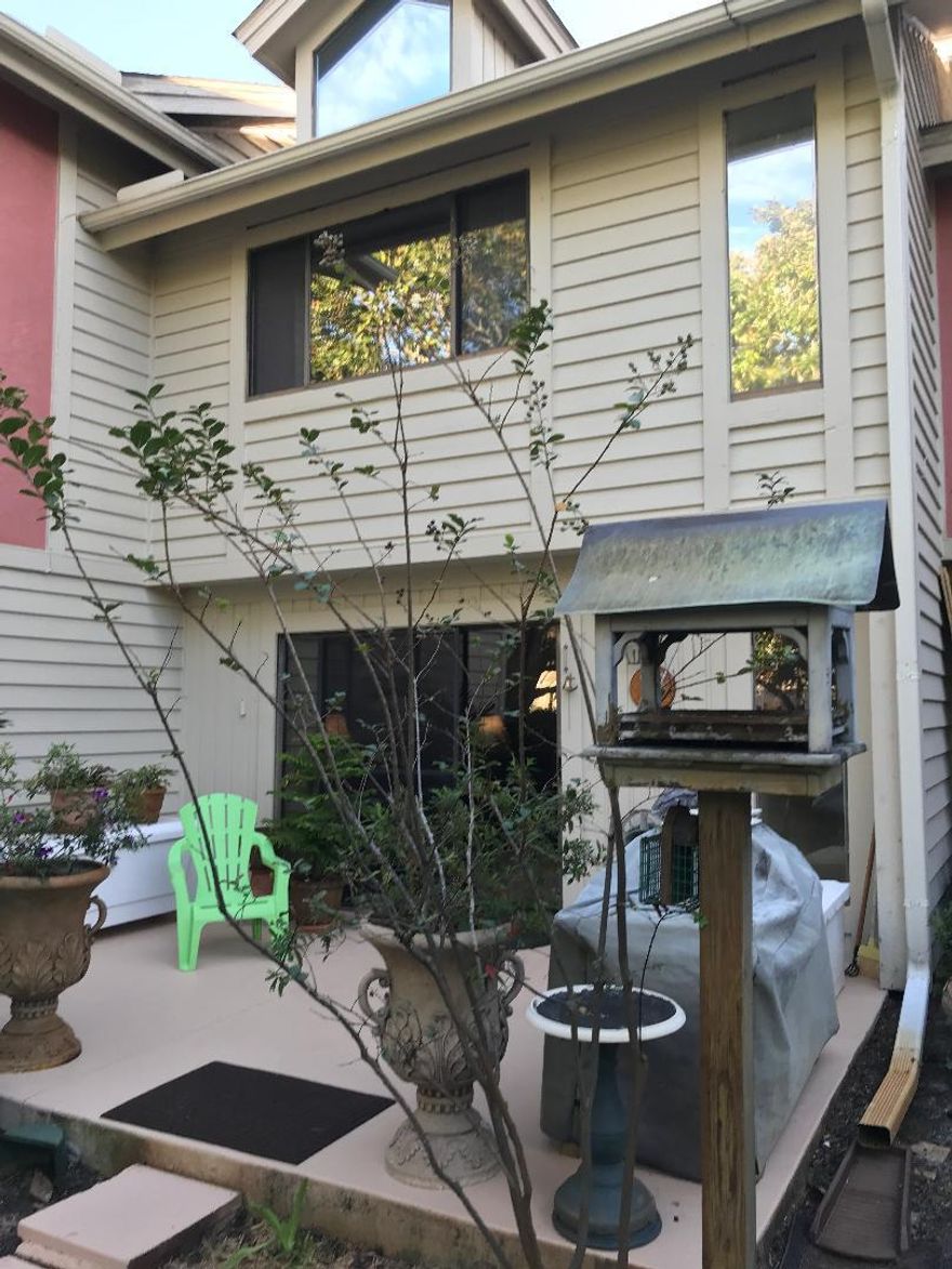 This spacious 2 bedroom, 2.5 bath with a bonus room, beautiful new kitchen with custom designed cabinets & stainless appliances. Sliding glass doors open onto a private patio area surrounded by trees. The upstairs features two master suites with a staircase leading to the finished attic that has a heating/cooling system and can be used for extra guests or climate controlled storage. Close to shopping and the beach yet still quiet and peaceful. Come check it out you wont be disappointed.