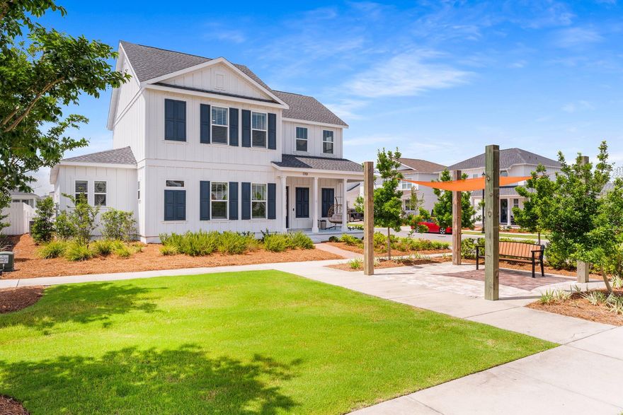 Step into the epitome of refined coastal living at this exquisite 5-bedroom, 4-bathroom estate nestled on a prominent corner lot in the sought-after SweetBay community. Boasting one of the largest floor plans available, the coveted St. George layout, this residence spans nearly 3,200 square feet of beautifully curated living space. The stately three-car garage is detached for architectural distinction, while a privacy-fenced backyard offers serene outdoor living. A gracious, covered front porch welcomes you home, perfectly positioned to overlook lush green space for added tranquility and seclusion. Inside, sophisticated coastal charm meets modern luxury. Thoughtfully designed living and dining areas are adorned with custom shiplap accent walls and elegant oak luxury vinyl plank flooring. The gourmet kitchen is a true showpiece, featuring a stunning Artigiano Italian Alps tile backsplash, quartz countertops, ivory soft-close cabinetry, and a full suite of Gallery Series appliances which include a five-burner gas cooktop, built-in microwave, and separate oven. A walk-in pantry and dedicated coffee bar complete this culinary haven. 

The main level offers two generously sized bedrooms and two full baths which is ideal for guests or multigenerational living. The expansive primary suite is a private sanctuary, bathed in natural light and enhanced by plantation shutters. The spa-inspired ensuite boasts a zero-entry tiled shower, dual vanities, and a massive walk-in closet. Every inch of this home showcases elevated design; from the tailored window treatments and upscale lighting fixtures to custom mirrors and designer furniture, which is negotiable with the sale. 

Upstairs, a spacious secondary living area anchors three additional bedrooms and two full baths, offering versatility for a media lounge, home office, or guest quarters. The layout is ideal for creating a mother-in-law suite or children's wing. Outside, enjoy the best of Florida living under the expansive 30' x 23' covered patio, overlooking a lush, private backyard for your personal oasis for relaxation or entertaining. 

Located in SweetBay, this vibrant waterfront community offers over 5 miles of bayfront shoreline, two resort-style pools, basketball court, walking trails, playgrounds, and ample green space. The neighborhood also features the highly rated University Academy (Preschool-8th Grade), and a golf cart-friendly lifestyle. SweetBay is also home to its own Town Center, featuring a Publix, Starbucks, and plans for additional dining and retail options. 
Enhancing the allure of SweetBay, plans are underway for a premier 40-acre marina featuring over 100 wet slips and more than 250 dry boat storage spaces. At the heart of this development will be a state-of-the-art, 56,000 square foot dry storage boat barn which is set to be the only marina on North Bay. This exclusive amenity will offer unparalleled access to the water, making SweetBay a true haven for boating enthusiasts and coastal lifestyle seekers alike. This is more than a home, it is a lifestyle. Schedule your private showing today and experience luxury coastal living in SweetBay.