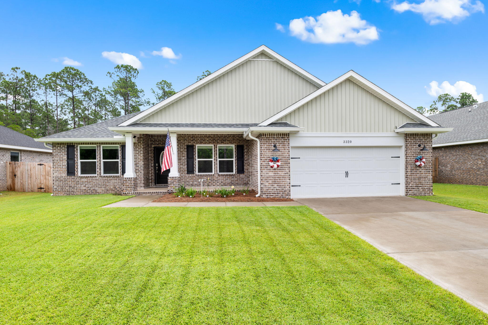 Welcome to this 2024 build home in the highly sought-after Secret Isle Estates in Navarre! This charming community features sidewalks and vintage-style street lighting, and is located just off Hwy 87 - tucked away and surrounded by a natural preserve that guarantees nothing will be built behind you. All while being just minutes from shopping, restaurants, and the sugary white sands of Navarre Beach! This better-than-brand-new home features an open and split floor plan with 4 bedrooms, 2 bathrooms, a separate office space/formal dining room, and a GORGEOUS chef's kitchen with granite countertops, solid wood cabinets with brushed nickel hardware, under cabinet and above cabinet accent lighting, pantry, stainless steel appliances and a wet kitchen island with breakfast bar. All with high-end finishes such as Luxury Vinyl Plank flooring throughout, high ceilings, crown molding, a double tray ceiling in the living room, and more! The primary suite has a tray ceiling and spa-like ensuite with double walk-in closets, a tiled walk-in shower, garden tub, double vanities, and a water closet. This home is just as thoughtfully upgraded outside - with whole house gutters, an epoxy coated front porch, covered patio, and garage floor, a weather resistant decking extension to the back patio - perfect for sunbathing or outdoor entertaining - and privacy fencing on the sides of the backyard and webbed fencing to the rear to still be able to enjoy the natural peace and tranquility of the surrounding preserve! Schedule your showing and make it all yours today!