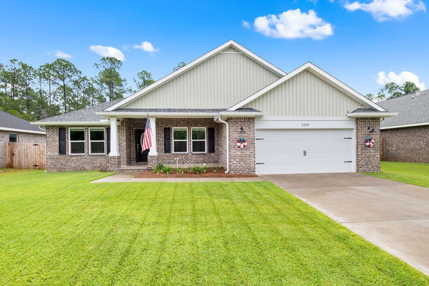 Welcome to this 2024 build home in the highly sought-after Secret Isle Estates in Navarre! This charming community features sidewalks and vintage-style street lighting, and is located just off Hwy 87 - tucked away and surrounded by a natural preserve that guarantees nothing will be built behind you. All while being just minutes from shopping, restaurants, and the sugary white sands of Navarre Beach! This better-than-brand-new  home features an open and split floor plan with 4 bedrooms, 2 bathrooms, a separate office space/formal dining room, and a GORGEOUS chef's kitchen with granite countertops, solid wood cabinets with brushed nickel hardware, under cabinet and above cabinet accent lighting, pantry, stainless steel appliances and a wet kitchen island with breakfast bar.  All with high-end finishes such as Luxury Vinyl Plank flooring throughout, high ceilings, crown molding, a double tray ceiling in the living room, and more! The primary suite has a tray ceiling and spa-like ensuite with double walk-in closets, a tiled walk-in shower, garden tub, double vanities, and a water closet. This home is just as thoughtfully upgraded outside - with whole house gutters, an epoxy coated front porch, covered patio, and garage floor, a weather resistant decking extension to the back patio - perfect for sunbathing or outdoor entertaining - and privacy fencing on the sides of the backyard and webbed fencing to the rear to still be able to enjoy the natural peace and tranquility of the surrounding preserve! Schedule your showing and make it all yours today!