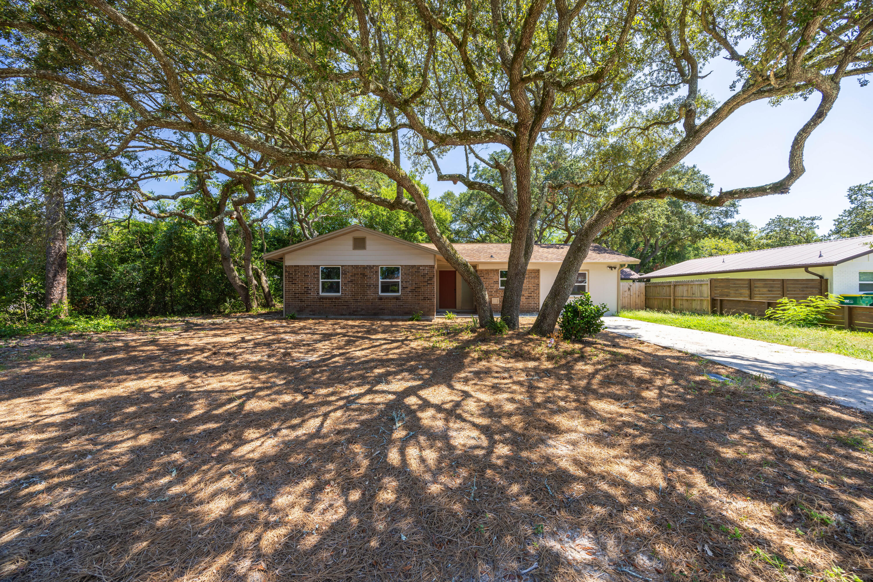 This beautifully remodeled home in Shalimar, FL, boasts modern upgrades including new granite countertops, updated electrical wiring, a new water heater, fresh paint, brand-new carpet, updated appliances, and a recently installed fence. With 4 bedrooms and 2.5 baths, the residence is ideally situated just 4 miles from Eglin Air Force Base and 7 miles from Hurlburt Field, making it an excellent choice for military families. Conveniently located near shopping centers and schools, it also provides easy access to stunning beaches just 7 miles away--perfect for beach enthusiasts.