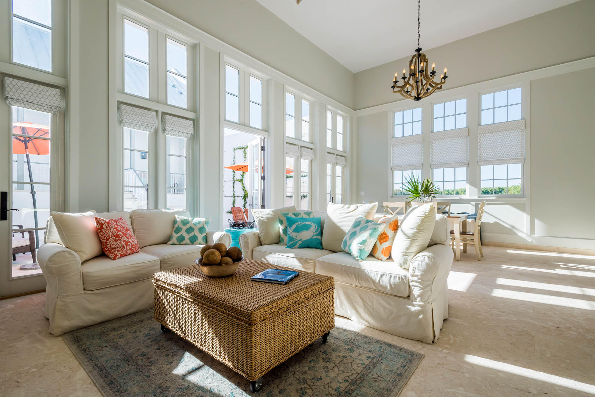 Upon entering this centrally located rowhome, fall under the spell of sophisticated coastal living in a light-filled private oasis. Caliza Courts rowhomes are designed by the renowned Khoury-Vogt Architecture team and form a welcome addition to the breathtaking Caliza Pool location. Beautiful architectural details have been woven into every space of this 4 Bedroom, 4.5 Bath home.Impressive scale of the great room awes with 16-foot ceiling,12-foot tall French doors and windows opening to a private courtyard, and guest suite beyond. Floor plan offers the utmost in comfort to accommodate friends and families. The open concept kitchen captures views of southern sunbathed skies and offers top of the line Thermador appliances, cabinetry, and glass tile accented walls.The main level Master
