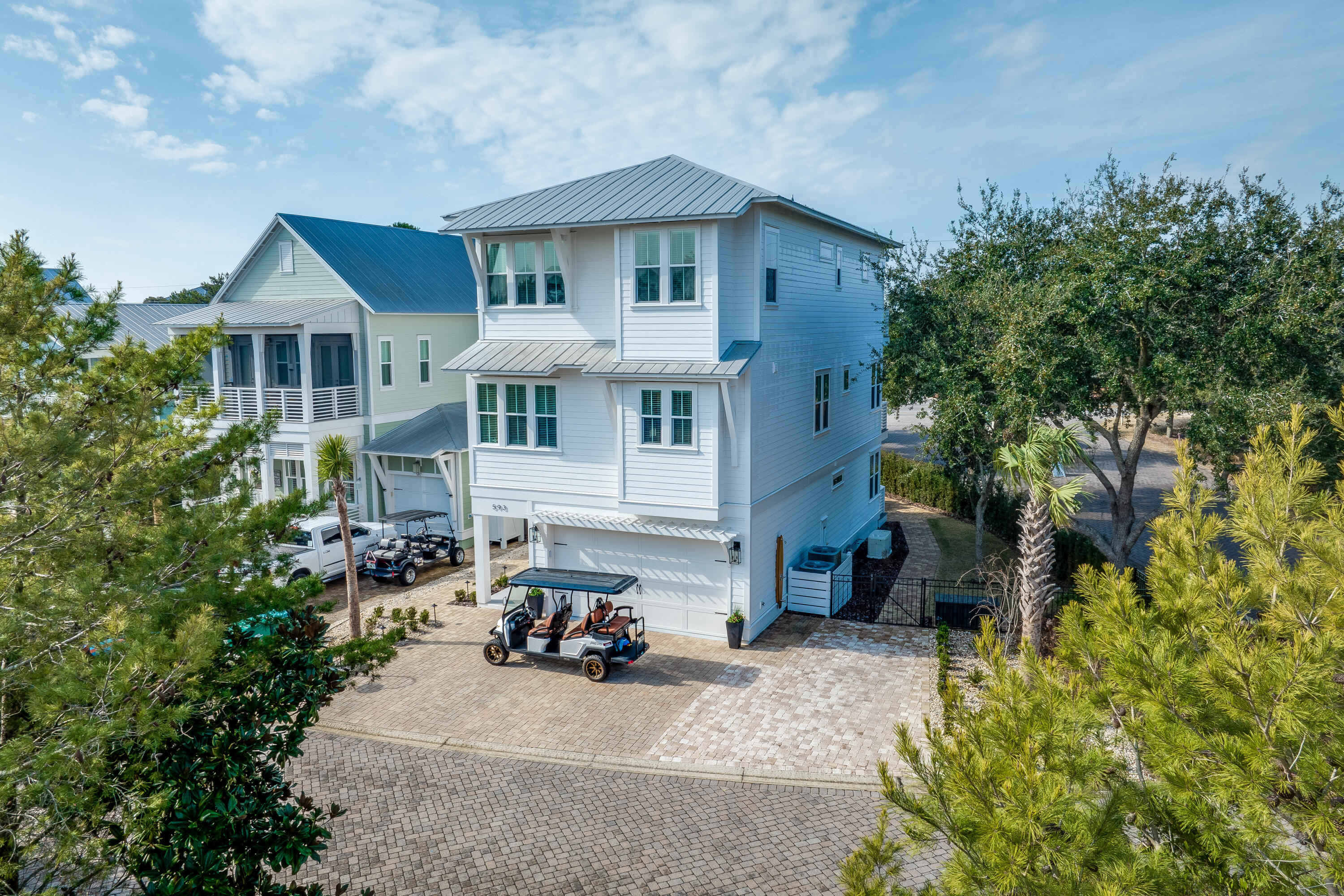 WOW!! Paradise Found! The Best Buy along 30-A! An incredible & luxurious beach house in one of the most sought-after communities on 30-A! Prime Location- close to the beach, with 6 quick-access beach options! Enjoy your neighborhood resort-style heated pool, hot tub, fire pit & observation tower, providing picturesque views of the pristine Gulf! Hop on your customized 2021 6 passenger golf cart, only minutes away from the beach, Seaside, popular restaurants & shopping. This meticulously-cared-for spacious 4 BR, 4 bath beach house is fully furnished, rental ready, featuring a rarely included ELEVATOR & a new Generac backup generator, ensuring guests are never without power. Over 3500sf of luxury, loaded with features, accents, & creature comforts.A beautifully updated gourmet kitchen