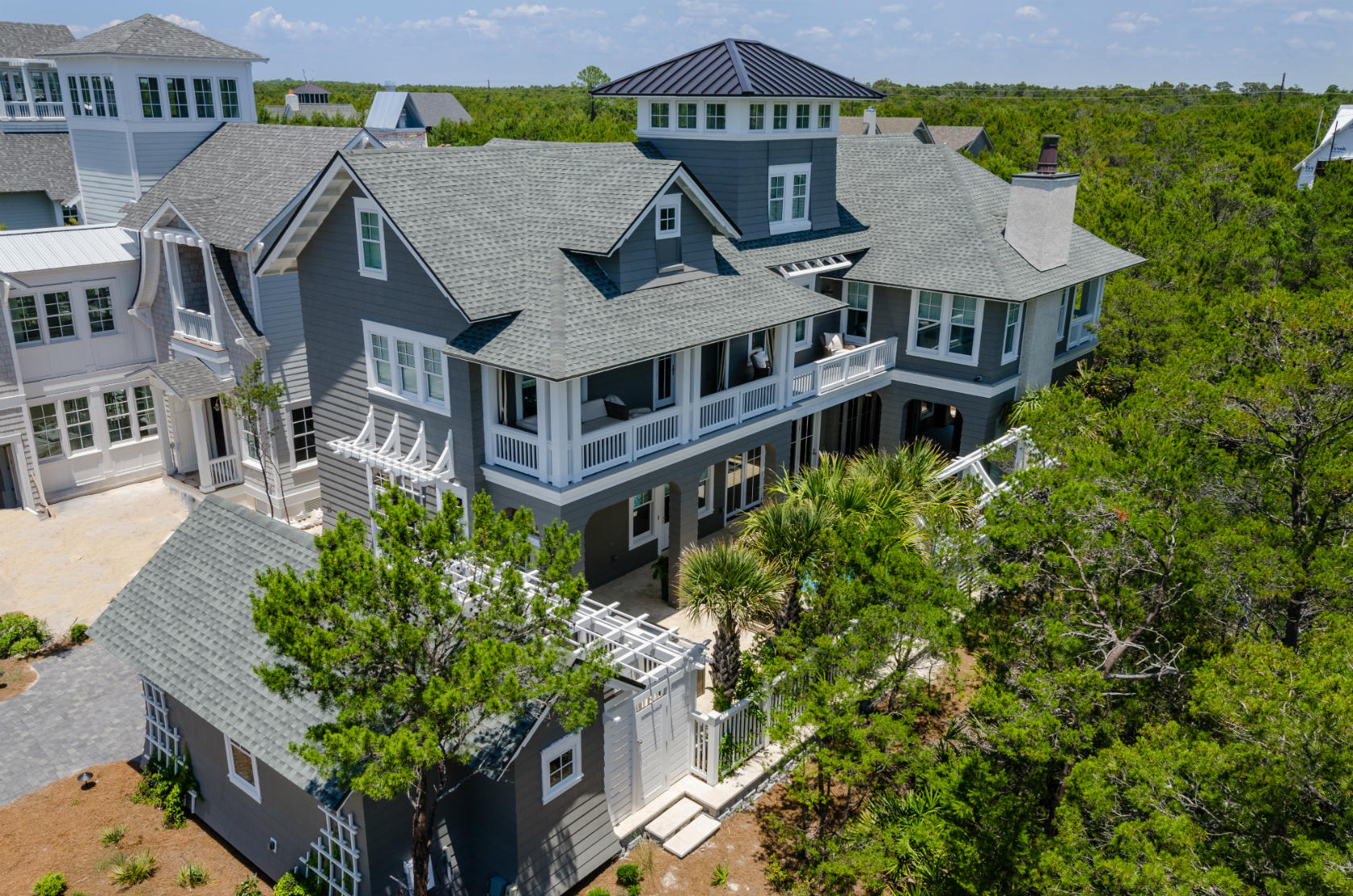 Spectacular CUSTOM home in Watersound Beach. 2nd home, NEVER rented & less than 2 years old. Designed by Greg Jazayeri Design, built by Kenson Group and interior design and decor by Nest Decor. This home truly maximizes the indoor/outdoor living space with 4,090 SF, 5 bedrooms, 5 full baths and 2 half baths & ELEVATOR. Amazing open-concept floor plan with 11.5' ceilings on 1st fl, gourmet kitchen with Carrera Gold Marble, Thermador appliances, double gas range with griddle, separate ice maker, wine cooler, HUGE island and LARGE walk-in pantry. 2 Nano walls open to the loggia with a custom 12x24 gas heated pool with fountains & fire features, outdoor fireplace with covered area. Dining room has built in wine bar & storage, living room extremely spacious. 2nd fl has 2 guest bedrooms with