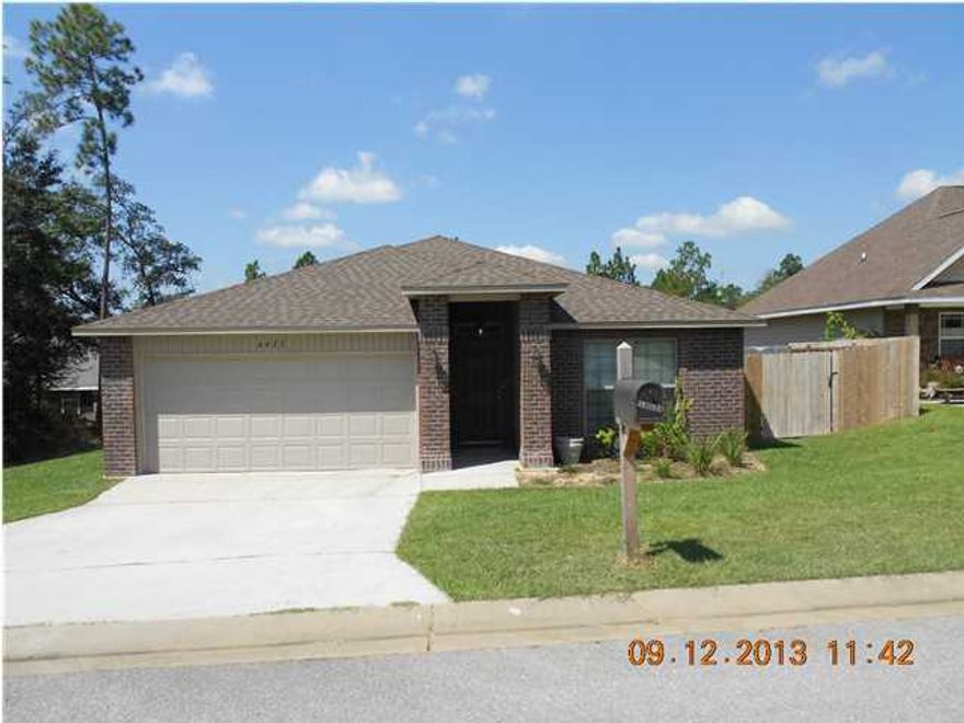 South of I-10 and beautiful brick home!!!! Custom colors thru out and spacious. Granite countertops with island, oversized sink, pantry, stainless appliances, wood cabinets!!! Stainless appliances. Ceramic floors in kitchen, foyer, bath and laundry room. Check out the size of the family room!!!! Back porch is covered. Only 1 mile from public boat launch. Back yard is completely privacy fenced. Owner has requested no cats, please...