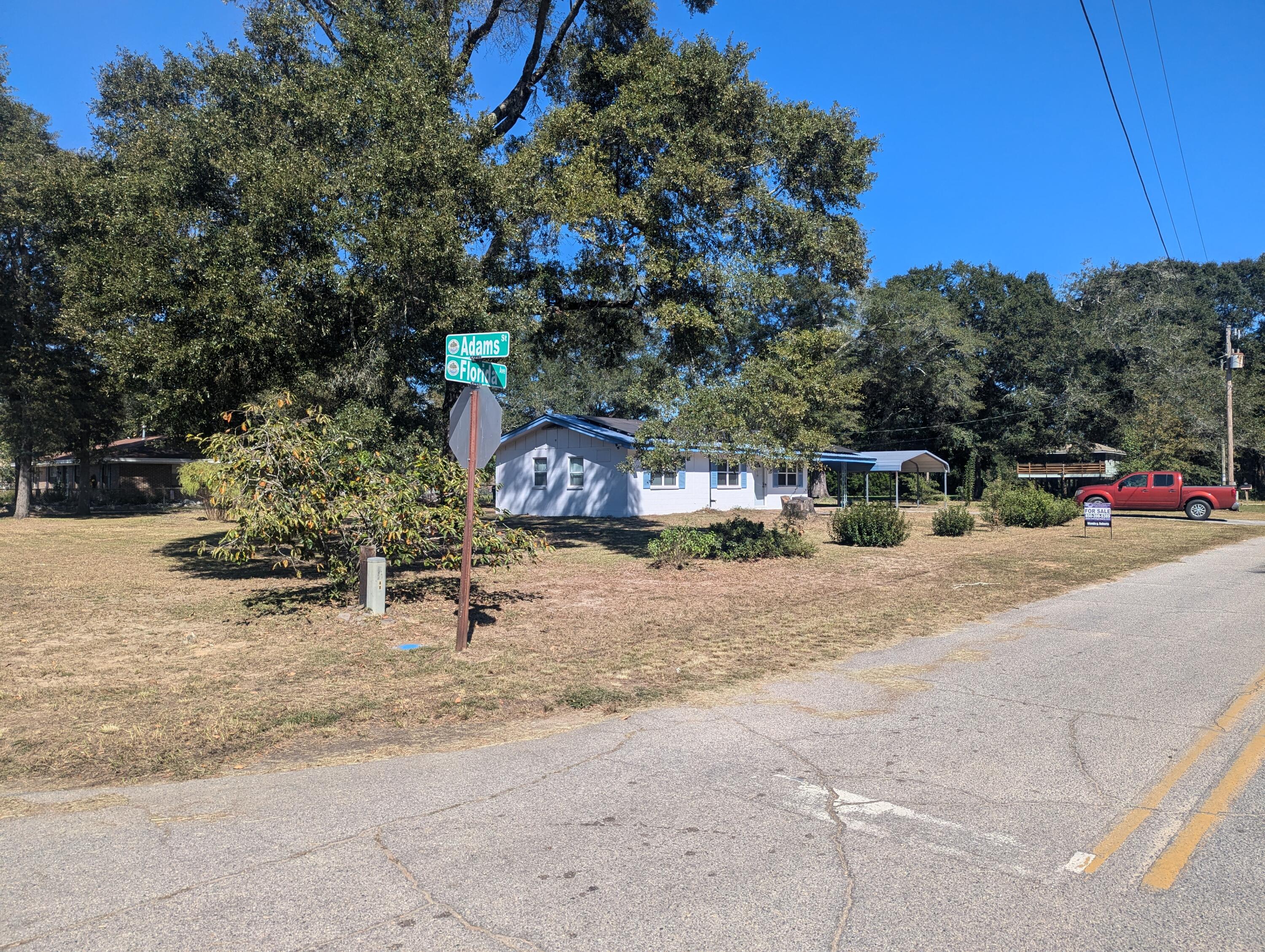 Large corner lot~ 2-bedroom 1 bath block home just minutes to Florala and 30 minutes to Crestview~ Laundry room is off the carport~ Kitchen has smooth top stove, dishwasher, and stainless-steel refrigerator~  Dining room has built in cabinets~ HVAC was replaced in April 2023 and water heater was replaced in January 2022~  Roof is approximately 10 years old ~ There are solar panels on the house~ With some TLC this could be a great home~  Being sold AS IS WHERE IS~