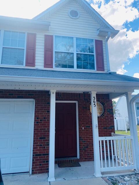 This is a large end unit townhome with 3 bedrooms and 2 bathrooms located upstairs with a 1/2 bath located downstairs.  This townhome also offers a 1 car garage.