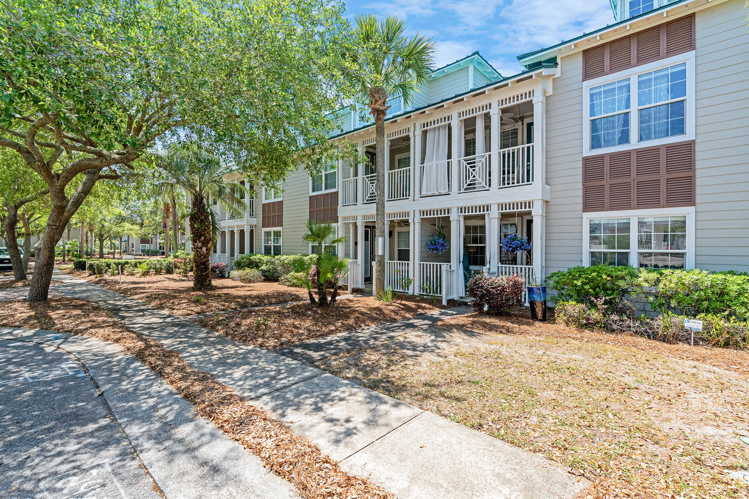 Discover the beach condo you have been searching for in this stylishly updated, 3-bedroom, 2-bathroom, first-floor, end-unit, with parklike surroundings and views. Offering perhaps the most private location behind the gates of the Village at Blue Mountain Beach, with the community pool and fitness center merely steps away. The community hosts a Village putting green, shuffleboard courts and golf cart parking. Recent updates include shiplap detailing, floor-to-ceiling-tiled walls in the kitchen and bathrooms, luxury-vinyl flooring, floating shelves, and more. Conveniently located outside the Village gates are local eateries, a coffee shop and ice cream parlor. The public beach access is approximately 1/2 a mile away. This fully furnished condo is not on a rental program and is a must-see!