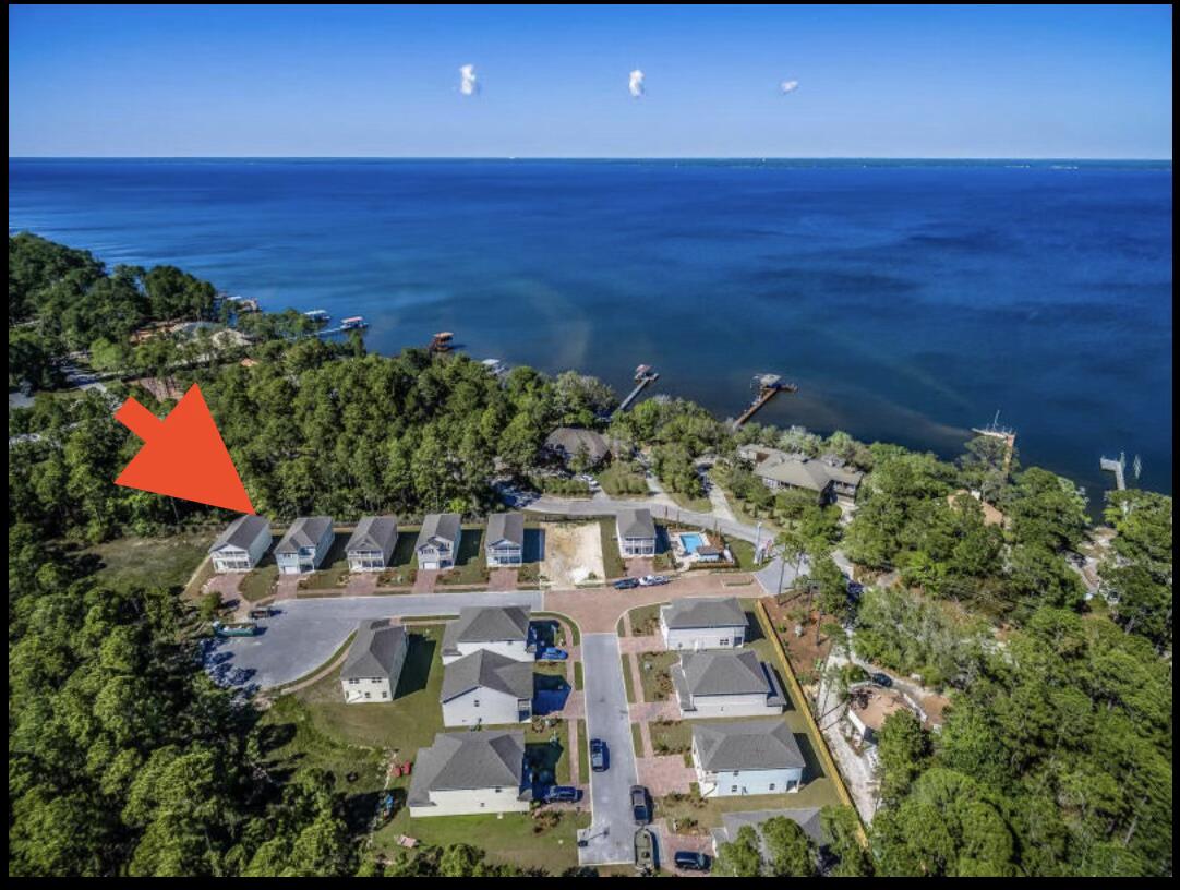 This freshly painted home in Tranquility By The Bay has fabulous full length balconies off living room and Master Suite to view the sunsets and feel the tranquil Bay breeze from your front porch. Community is Steps from the Bay and minutes from the Beaches of the Gulf. Intimate community in the heart of Santa Rosa Beach, Tranquility By The Bay is a pool community! Nearby is a public park with boat launch, basketball courts, great kayaking & paddle boarding. Take a short drive to the beaches of the Gulf of Mexico or spend the day along 30-A all within minutes from the community. Granite countertops in kitchen and baths, Light cabinets, Hardwood Like Tile throughout bottom floor, brand new carpet upstairs and fresh interior paint throughout. Schedule your private showing today