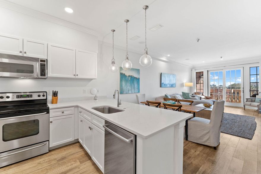 Enjoying a prime location between the Alys and Rosemary Beach communities, this desirable corner end unit is within the sought-after Village of South Walton. Reached by elevator, this third-floor unit has been remodeled and newly painted with thoughtful upgrades. Once you step through the solid wood front door, there's a guest suite with a full bathroom on one side and a bunk room on the other. Wood plank flooring leads into a large remodeled kitchen with a breakfast bar, creating a natural separation from the dining and sitting areas. White quartz countertops provide ample workspace along with stainless steel appliances and a pantry. A separate laundry closet hides the newer washer and dryer. Gulf Views from the balcony and Resort Pool and Spa views from the Terrace and Foyer. The condo has a bright open floor plan extending onto a private balcony for enjoying outdoor dining and fresh sea breezes with glimpses of the shimmering gulf. White walls, large windows and eye-catching new lighting fixtures in the living room ensure ample light throughout. The master suite is truly luxurious, with a large ensuite bathroom featuring a corner jetted tub, a walk-in shower and a twin vanity. The bedroom has dual-aspect views and a door leading out onto the balcony. It has far-reaching views across the roofs and treetops and peeks of the emerald gulf beyond. This luxurious beach home includes all-new, tasteful and elegant furnishings. The resort pool is catty-corner to the stylishly architected condo building. Beach access is a short walk or bike ride away; there's even bike storage on-site. Whether seeking a premier vacation home or a long-term investment, this residence delivers the ultimate 30A lifestyle.