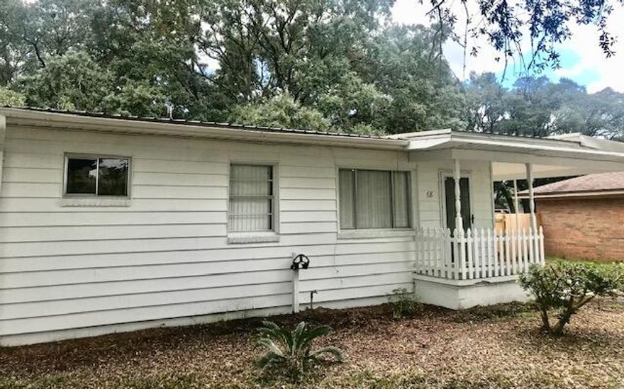 Move in ready and well maintained Florida cottage home located in very desirable location near military bases, restaurants and shopping. Home has a metal roof, and newer central HVAC. Located on corner lot with lots of parking and huge fenced in back yard with beautiful trees. Has covered back porch and storage shed in back yard. Home also has covered carport. Easy to show, set up your appointment to view today!