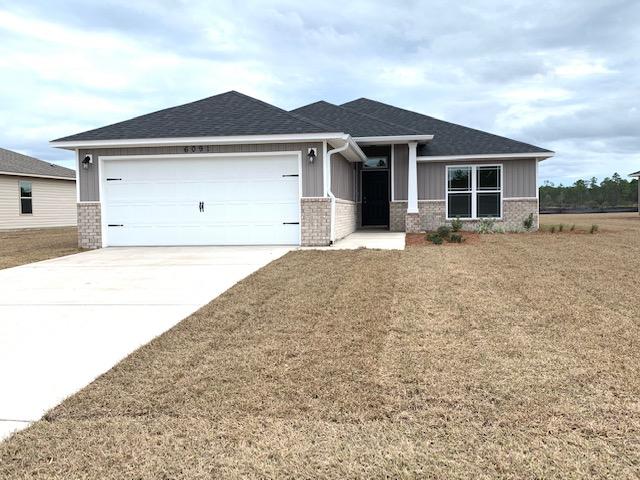 Home under construction. COLORS AND FEATURES MAY VARY FROM PHOTOS. Heather's Place features fully sodded yards, sidewalks, underground utilities, public water and sewer, convenient access to shopping and schools and only 8.5 miles to Navarre beach! Every home comes included with GRANITE COUNTER TOPS tops in the kitchen and bathrooms with under mount sinks, STAINLESS STEEL APPLIANCES in the kitchen, UPGRADED FLOORING in the common and wet areas and carpet in the bedrooms. Separate TILE SHOWER in the master bathroom (in most plans), covered back porches and much more. These homes are extremely energy efficient and all come included with our 1-year builder warranty. Take advantage of our $500 move in special with use of one of our preferred lenders!