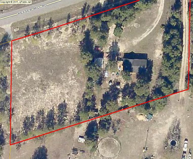 1 acre parcel in the quiet community of Baker. Lot has been mostly cleared except for some perimeter ''buffer'' trees. Access driveway is asphalted and water taps are in place.