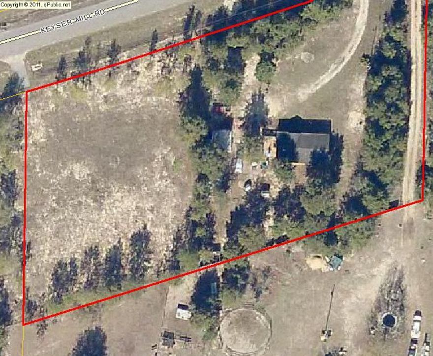 1 acre parcel in the quiet community of Baker. Lot has been mostly cleared except for some perimeter ''buffer'' trees. Access driveway is asphalted and water taps are in place.