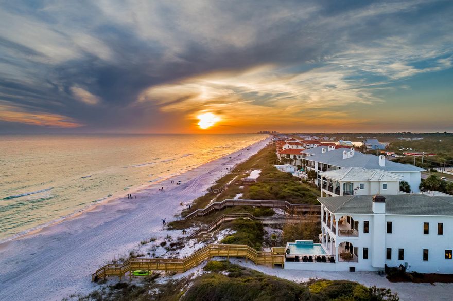 Experience luxury Gulf front living on 30A. Towering over the Gulf of Mexico, breathtaking views from every room await! Stunning architecture and spacious design characterize this private beachside retreat. Features of this astonishing home include a lavish Gulf side pool, private beach walk-over, a well-equipped summer kitchen, a state-of-the-art home theater, designer interiors and luxury finishes. This fully renovated 5,743 square foot home offers a jaw-dropping master suite, 3 king junior suites, one queen suite, two bunk rooms, and 6.5 bathrooms; comfortably sleeping 24. The property boasts an enormous great room overlooking the Gulf of Mexico featuring a chef's kitchen, custom shuffle board table, dining for the entire family, wet bar, and a spacious living area centered