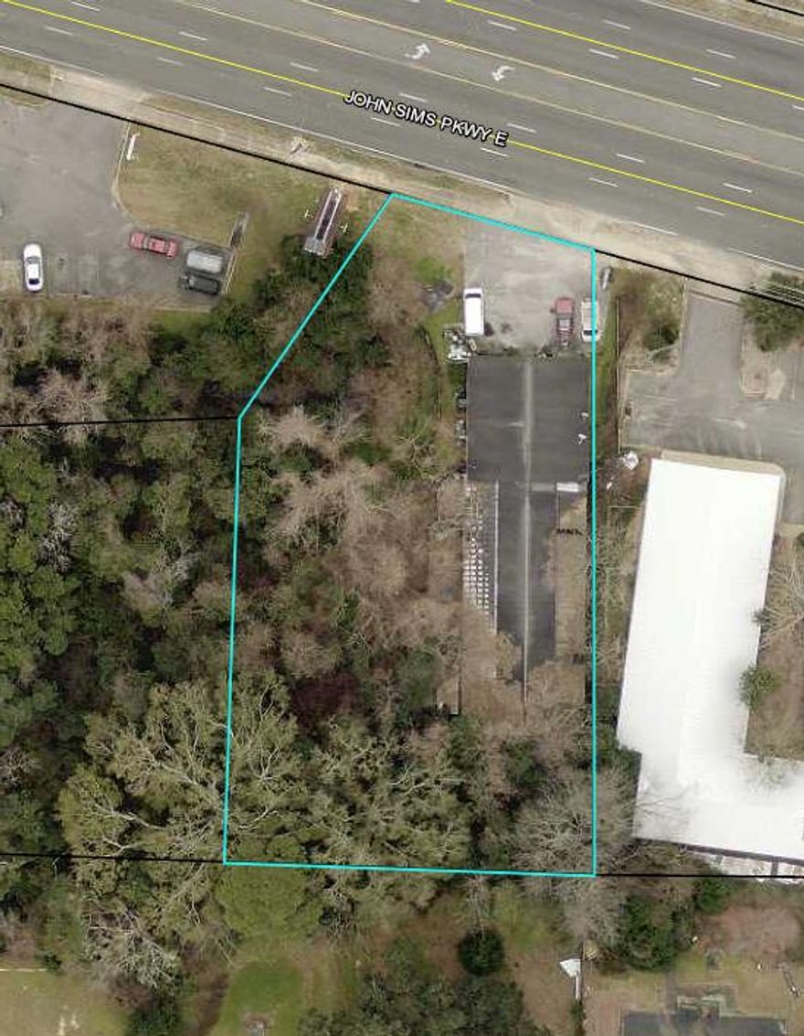 Property has old building that was a dog kennel.  Building in bad shape with concrete slab cracked and floors not level.  Ideal lot to redevelop with new building.  Selling in AS IS condition.  Priced at $6.13 a sqft