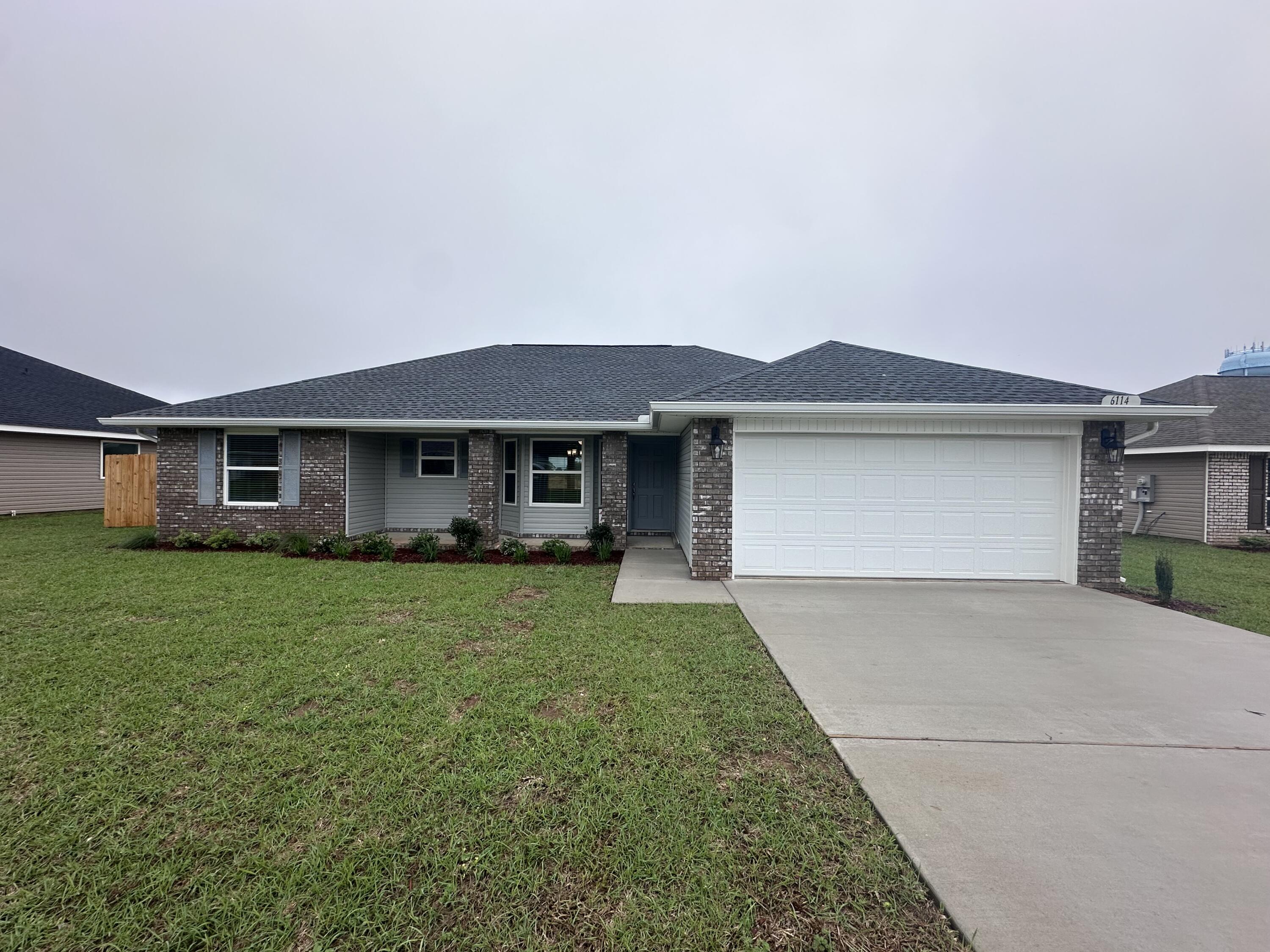 This home is situated in the quaint new subdivision of Ashton View. The front is brick with attractive 3 sided vinyl. As you enter through the front door the dining and kitchen area is to the left. The kitchen is bright with natural lighting as the dining area has a bay window and there is another window above the sink. The breakfast bar overlooks the living area which exits to the 10' x 20' covered back porch. The yard is fully sodded and professionally landscaped. Back inside are 2 bedrooms as well as a master suite. The master suite bath has dual vanities and a separate walk-in shower with a garden tub. All wet areas have durable Proplus flooring with carpet everywhere else. Electric stainless appliances (microwave, stove and dishwasher)are included. Plan your visit today.