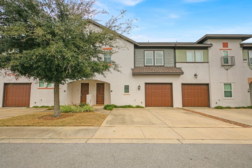 Great opportunity to live in the conveniently located community of Destin Oaks. This immaculate home is like new and ready for occupancy. Upgrades throughout include: custom tile flooring, granite countertops in kit and baths, crown molding, 6'' baseboards, stainless appliances - inc refrigerator, high impact windows, window treatments and more! The mbath has a garden tub w/tile surround and a walk in tile shower. Sliding doors exit onto a large paver patio Also, this is one of the few units with a garage. This new development has a beautiful pool and clubhouse. Located off of Airport road, you are less than a mile away from the beach and local shopping / dining.