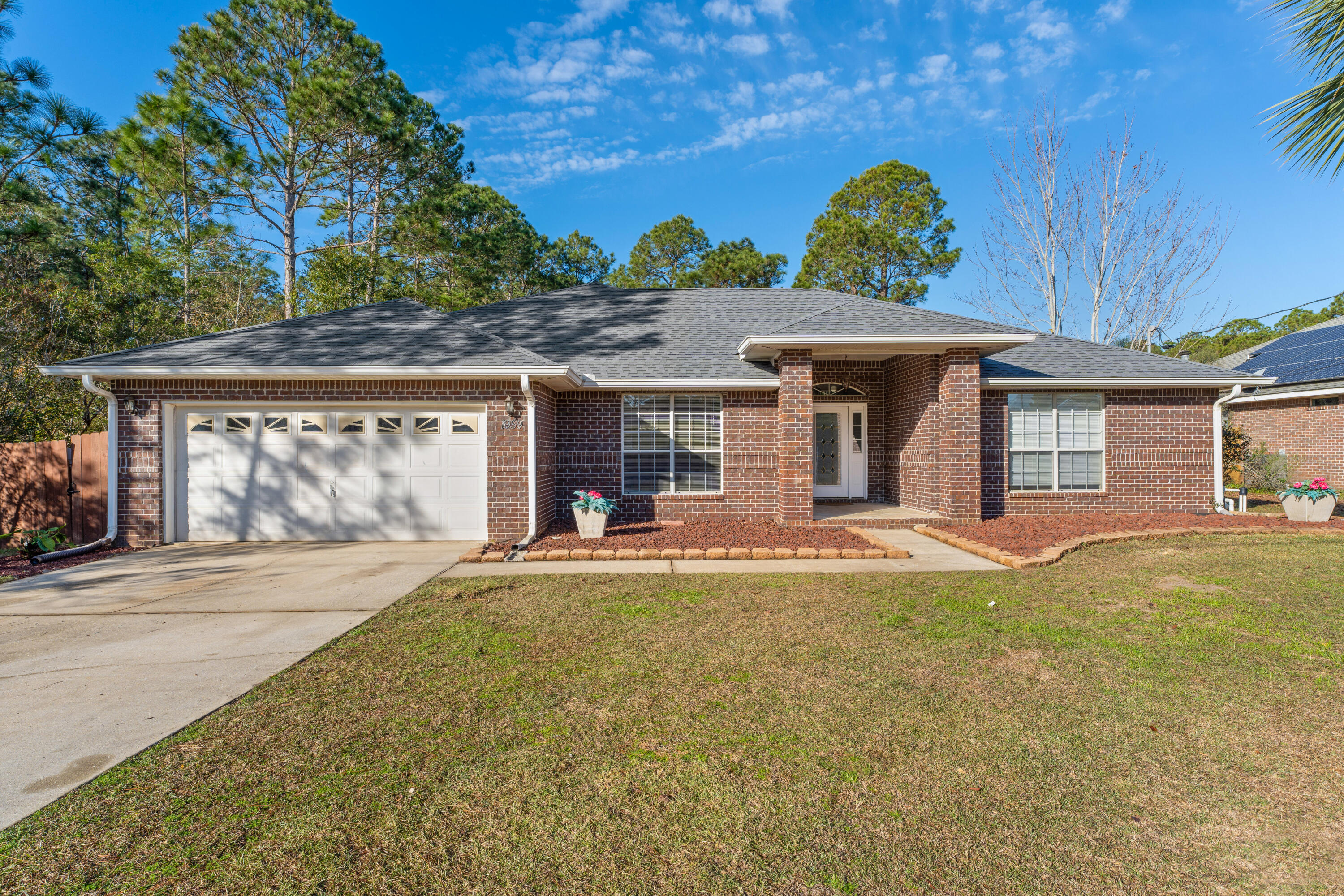 Welcome Home to a all brick contemporary home with amazing updates that make this home move in ready! The roof, HVAC system, water heater have all been replaced. Please see the feature sheet for the full list of cosmetic changes also.The property is located on the East entrance of Holley By The Sea, which supports a quicker commute to Hurlburt Field AFB. The recreational center has 3 pools to enjoy, a fitness center, tennis courts, sauna, steam room, game room, fishing pier, and a BOAT launch area! If you decide to have your own pool, there is plenty of room for one. The property has a flat backyard and it's on sewer, not septic. All of the flooring has been recently updated with a durable LVP brand that has the appearance of a wood-look. The kitchen has a modern backsplash, new....