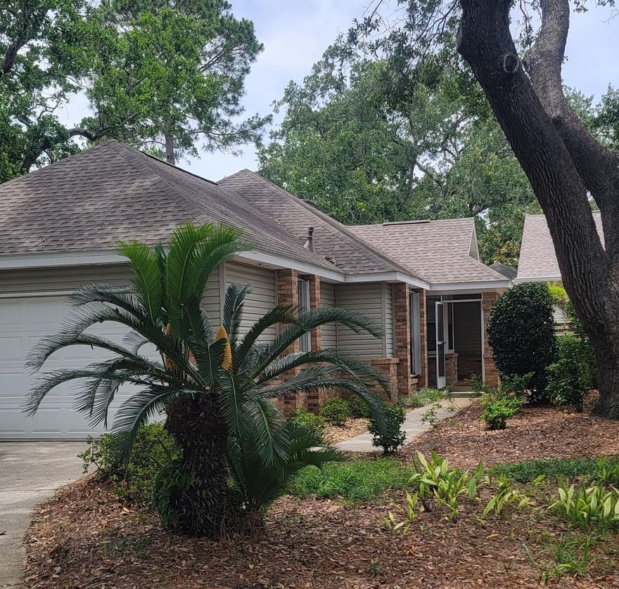 Nestled away in the private, lakeside neighborhood of Deerwood, this spacious, well-maintained 3 bedroom, 2 bath home offers a two-car garage, a bright and airy sunroom, and mature, lushly landscaped grounds. Upgrades to the home include enclosed screened porch, hardwood and tile flooring, and granite countertops. The backyard is an oasis of beautiful landscaping and has an expanded patio for seating and entertaining. This home won't last long! Deerwood owners enjoy access to the two heated SOA pools: One across from Linkside Village on Audubon Drive and the newly constructed Phil Hummel Aquatic Center centrally located at the Baytowne Ave Traffic Circle. As an introduction to the Sandestin lifestyle, we invite our new owners to explore amenities that make Sandestin special.