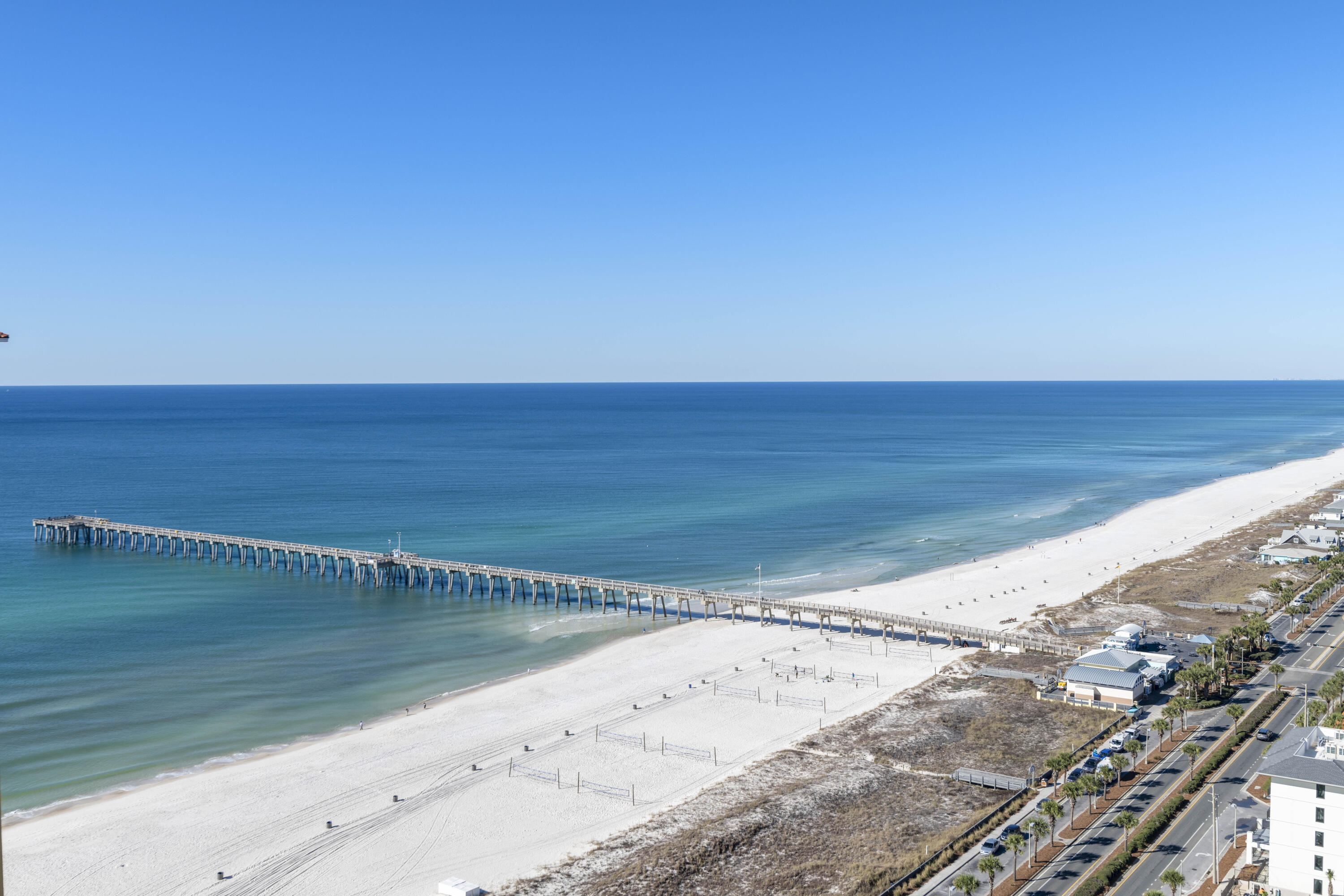 **Priced for Immediate Sale!!** This top-floor virtually staged penthouse at Calypso Tower III offers gulf-front living at its best. The coveted C floor plan offers stunning gulf views, and quiet location with no one living above make this a highly desirable unit. The living room has a spacious sitting area with a wall of sliding glass doors framing turquoise gulf views to the horizon. Wood-effect flooring, 10-ft. ceilings, and white walls create a neutral canvas for you to add your own accents. Step out onto the generous curved covered balcony and savor the gentle sea breeze and sound of the sea. It's an idyllic way to start each day.