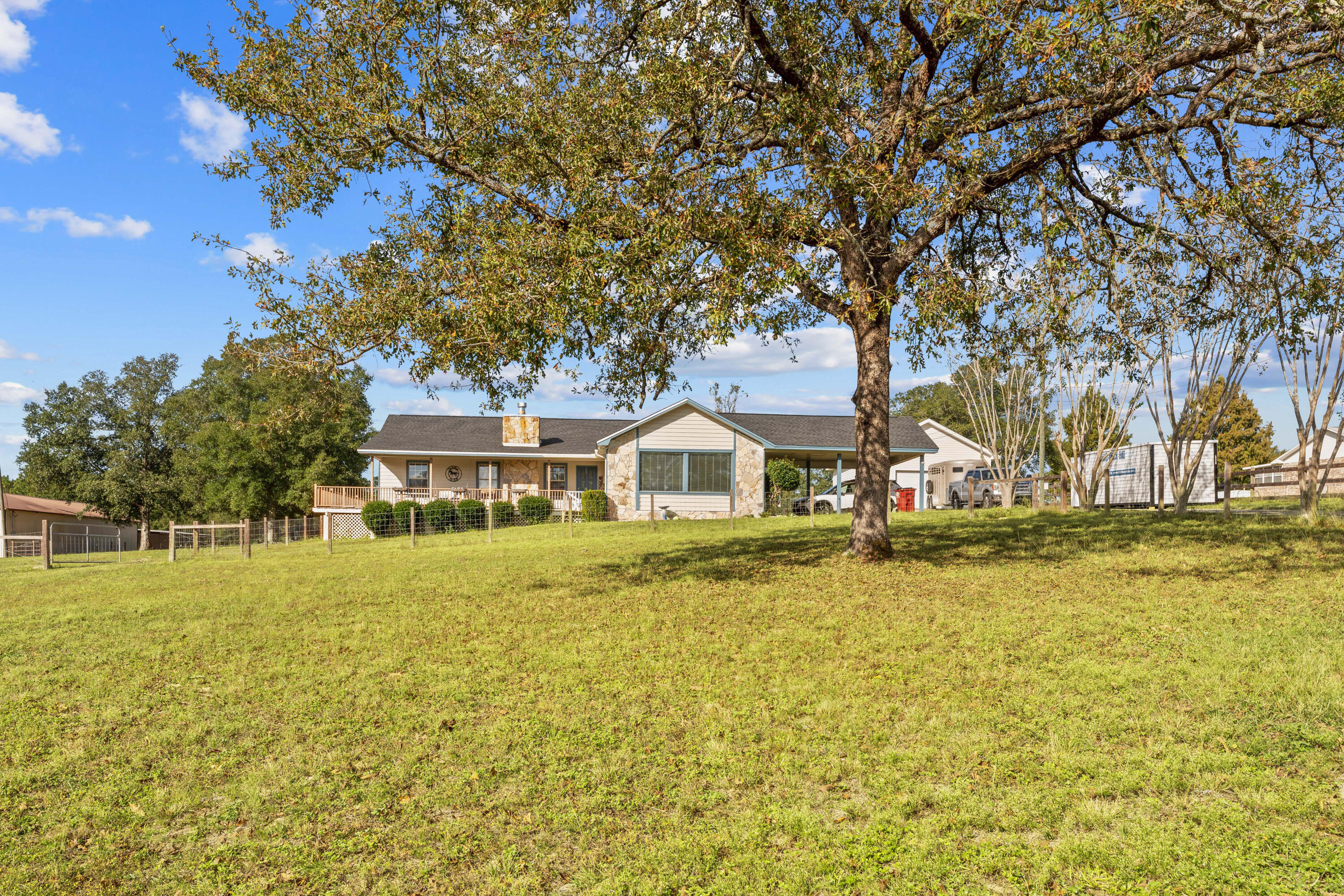 Beautiful ranch style estate on over 2 acres of fenced pasture with covered parking and 24 x 24 detached garage. 36 x 36 barn with 2-1212 Horse Stalls; 1-1010 Horse Stall; 1-1010 Tack Room; Storage space + Area for Hay Storage Electricity and Running water. Water line ran to ea. stall for automatic water. Window AC unit in tack room. The home is a cedar / vinyl sided 3 bedroom 2 bath home within 5 miles to shopping and downtown. As you enter from the carport, you are greeted with a relaxing den area before entering the main home. The kitchen offers a build-in oven, smooth top stove, dishwasher and breakfast bar. The living room offers wood flooring and a fire place to relax and enjoy the family. Good sized bedrooms to round it outCall to view