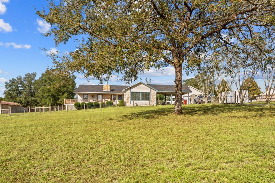 Beautiful ranch style estate on over 2 acres of fenced pasture with covered parking and 24 x 24 detached garage.   36 x 36 barn with 2-1212 Horse Stalls; 1-1010 Horse Stall; 1-1010 Tack Room; Storage space + Area for Hay Storage Electricity and Running water. Water line ran to ea. stall for automatic water. Window AC unit in tack room.  The home is a cedar / vinyl sided 3 bedroom 2 bath home within 5 miles to shopping and downtown.  As you enter from the carport, you are greeted with a relaxing den area before entering the main home.   The kitchen offers a build-in oven, smooth top stove, dishwasher and breakfast bar.   The living room offers wood flooring and a fire place to relax and enjoy the family.  Good sized bedrooms to round it outCall to view