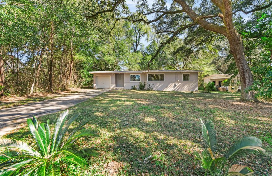 This charming and beautifully remodeled 3-bedroom, 1-bathroom home nestled in a tranquil neighborhood of northwest Pensacola. This attractive residence features a wealth of upgrades, including brand new windows, a modernized kitchen equipped with contemporary appliances, and a gas water heater to enhance your comfort and convenience.. inside you will be greeted by light-colored hardwood flooring that flows throughout the home, creating an open & inviting atmosphere. The thoughtfully designed layout includes a versatile flex space just be