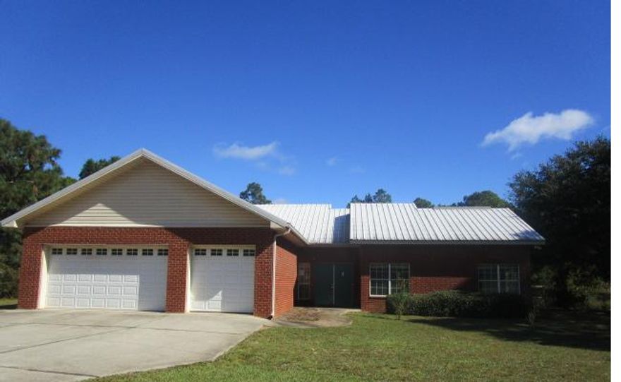 Very Unique 3 Bedroom, 2 1/2 Bath Brick Home Nestled on Almost an Acre of Gorgeous Property! This Home Features a Split Floor Plan ** Foyer ** Cozy Fireplace ** Open Kitchen with Large Pantry and Breakfast Bar ** Brick Floors ** Large Master Bath Complete with Jetted Tub, Separate Shower, Double Vanities and Walk In Closet. Master Bedroom has Private Screened Patio Access. Additional Features include Metal Roof, Brick Exterior, 3 Car Attached Garage. Listing Agent has taken all of the information from the County Property Appraiser's website. While the Listing Agent does believe that the acquired information is accurate, the Buyer and/or Buyer's Agent should verify all pertinent details related to this property, including but not limited to parcel dimensions, acreage, school zone, zoning cl