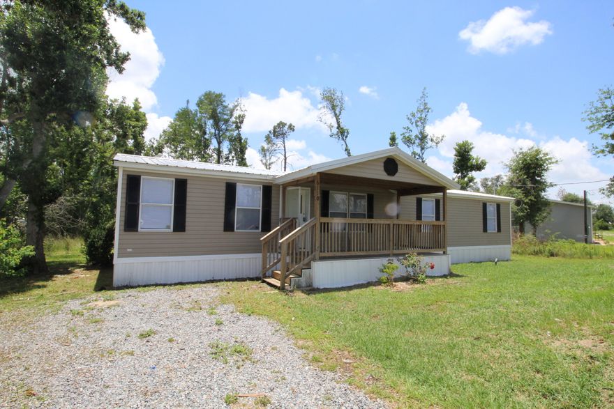 REO...Set on a little more than an acre, this 2001 Shultz manufactured home features 2 living areas, a fireplace, a private master suite with a garden tub, covered front porch, open rear deck, a metal roof, and fresh paint and flooring. *SELLER FINANCING OPTION* *all measurements approximate*
