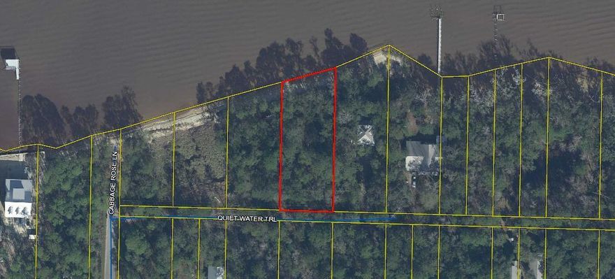 This is a double  heavily treed lot with 100 feet of Bay frontage. Short drive  to the beautiful beaches of South Walton. Build a dock and keep your boat right there and enjoy all the pleasures of boating on the Bay.